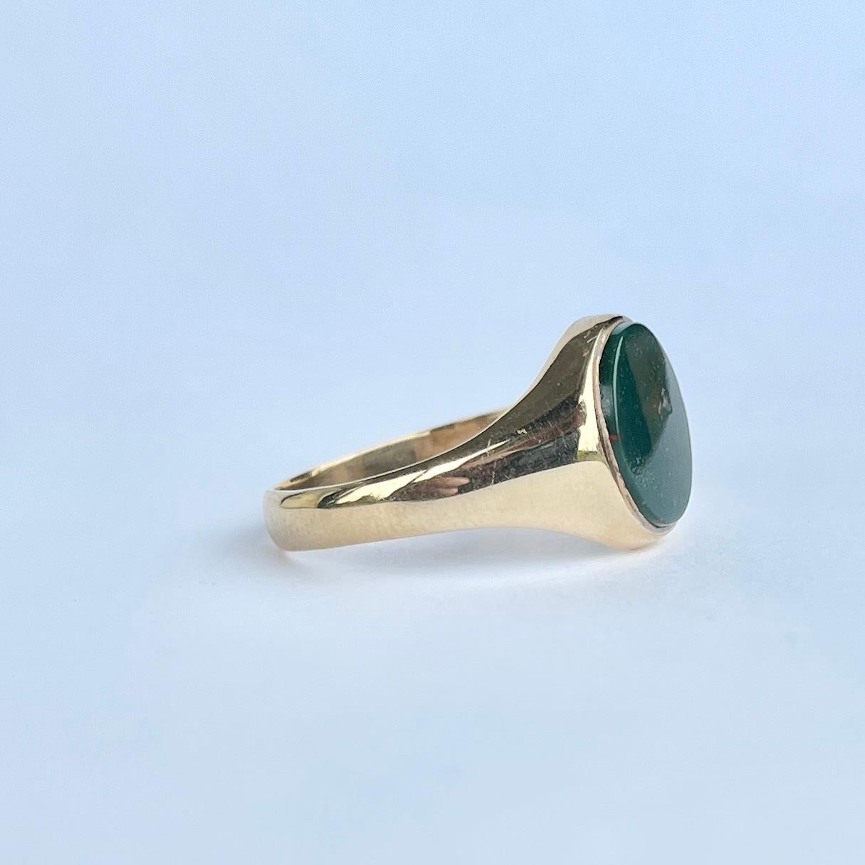 This gorgeous signet ring has a bloodstone set within the 9carat gold band. The stone is deep green with flecks of red running through. Fully hallmarked Birmingham 1975.

Ring Size: P 1/2 or 8 
Stone dimensions: 12x10mm 

Weight: 3.5g 