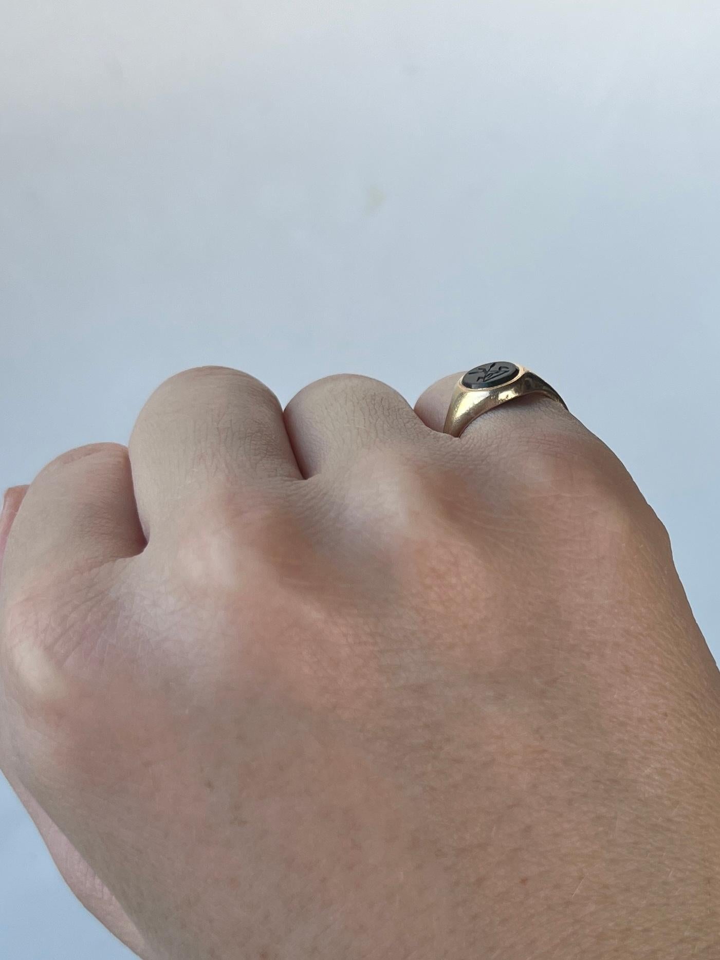 This gorgeous signet ring has a bloodstone set within the 9carat gold band. The stone is deep green with flecks of red running through with intricate engraving of tossed wheat stalks. Fully hallmarked Sheffield 1977.

Ring Size: 4 or H 1/2 
Stone