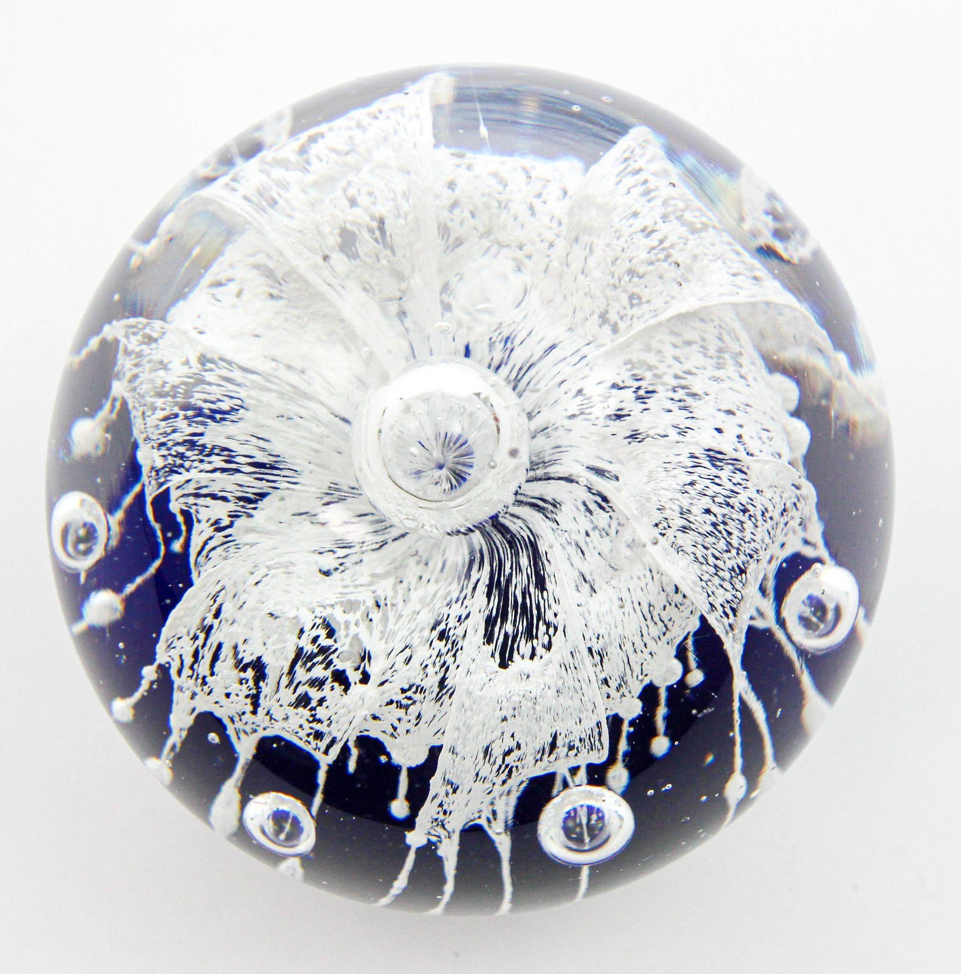 Vintage beautiful and colorful vintage Murano hand blown blue and white Italian art glass paperweight.
Gorgeous vintage studio hand blown crystal art glass paperweight with a cobalt blue base and a white cascading flower or frost.
The inside of the