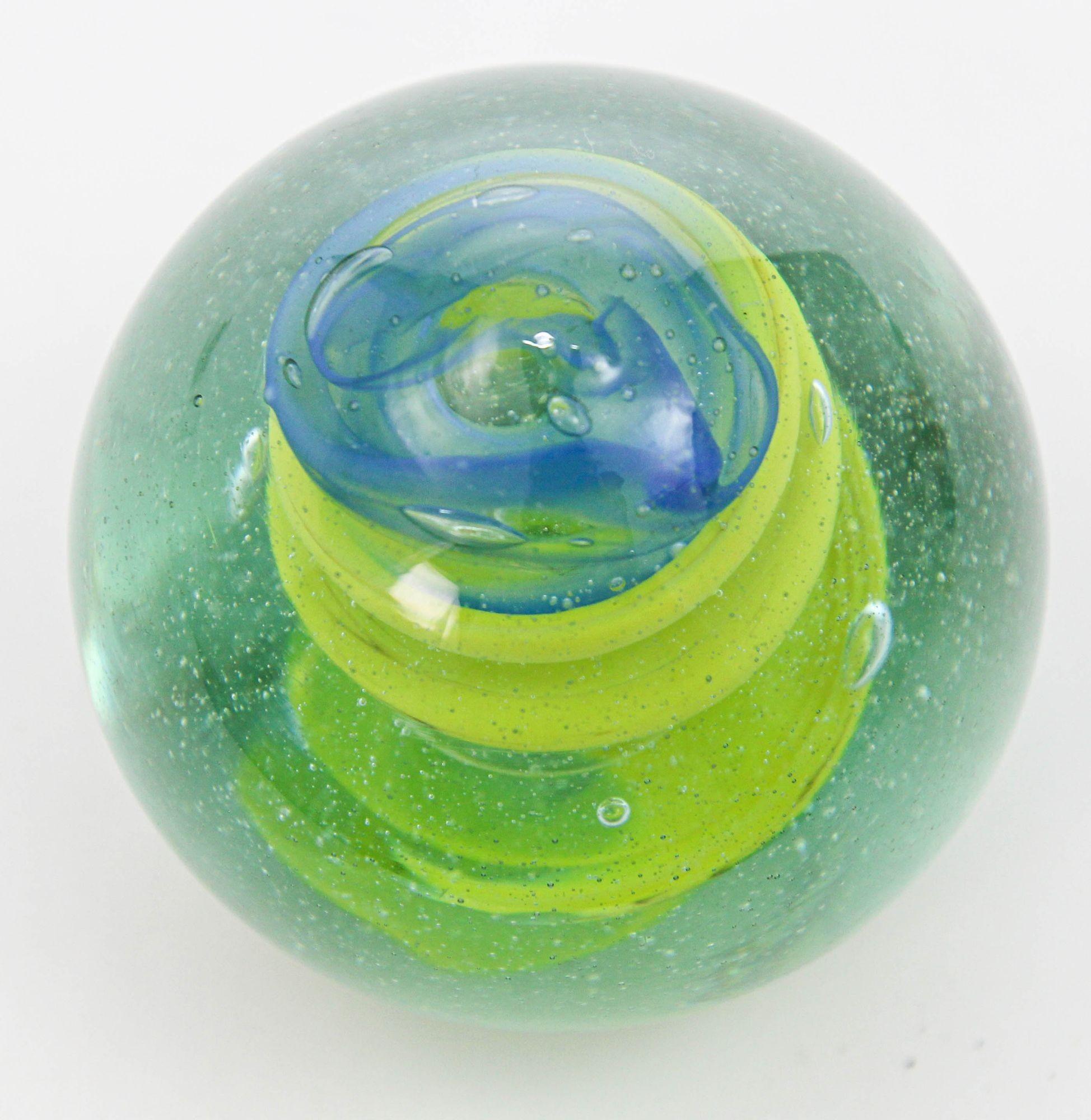 This vintage 1980's glass spiral paperweight or art glass object desk accessory.
Vintage crystal art glass paperweight in blue and green Swirl.
Paper weight for the sophisticated desk lime green spiral and blue sea waves sphere.
A compliment to any