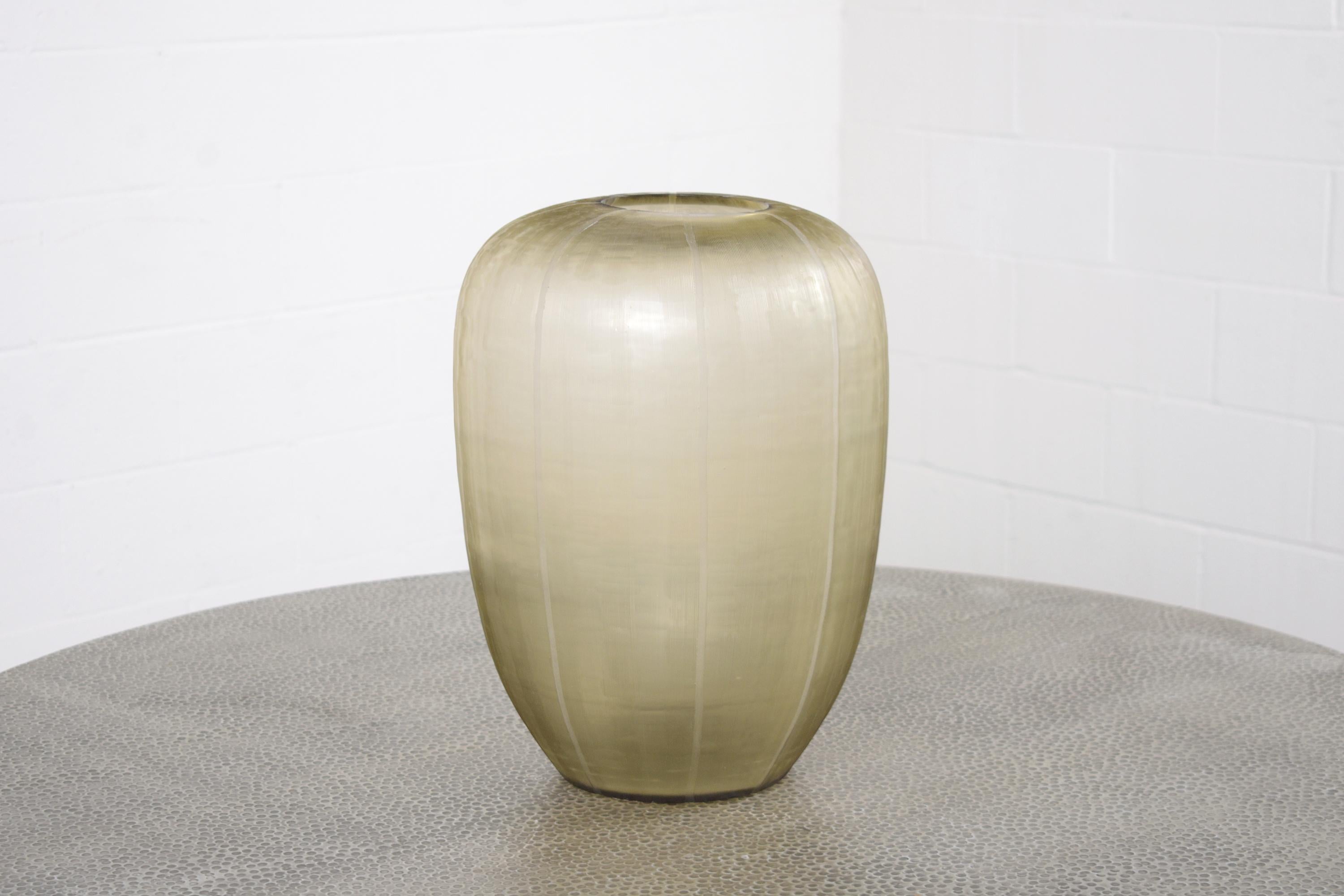 Discover an exquisite piece of art in our vintage 1960s vase, beautifully handcrafted by Guax Glass Co. This elegant art glass vase, stamped with the maker's mark, stands out with its distinctive smokey amber hue, intricately accented by an etched