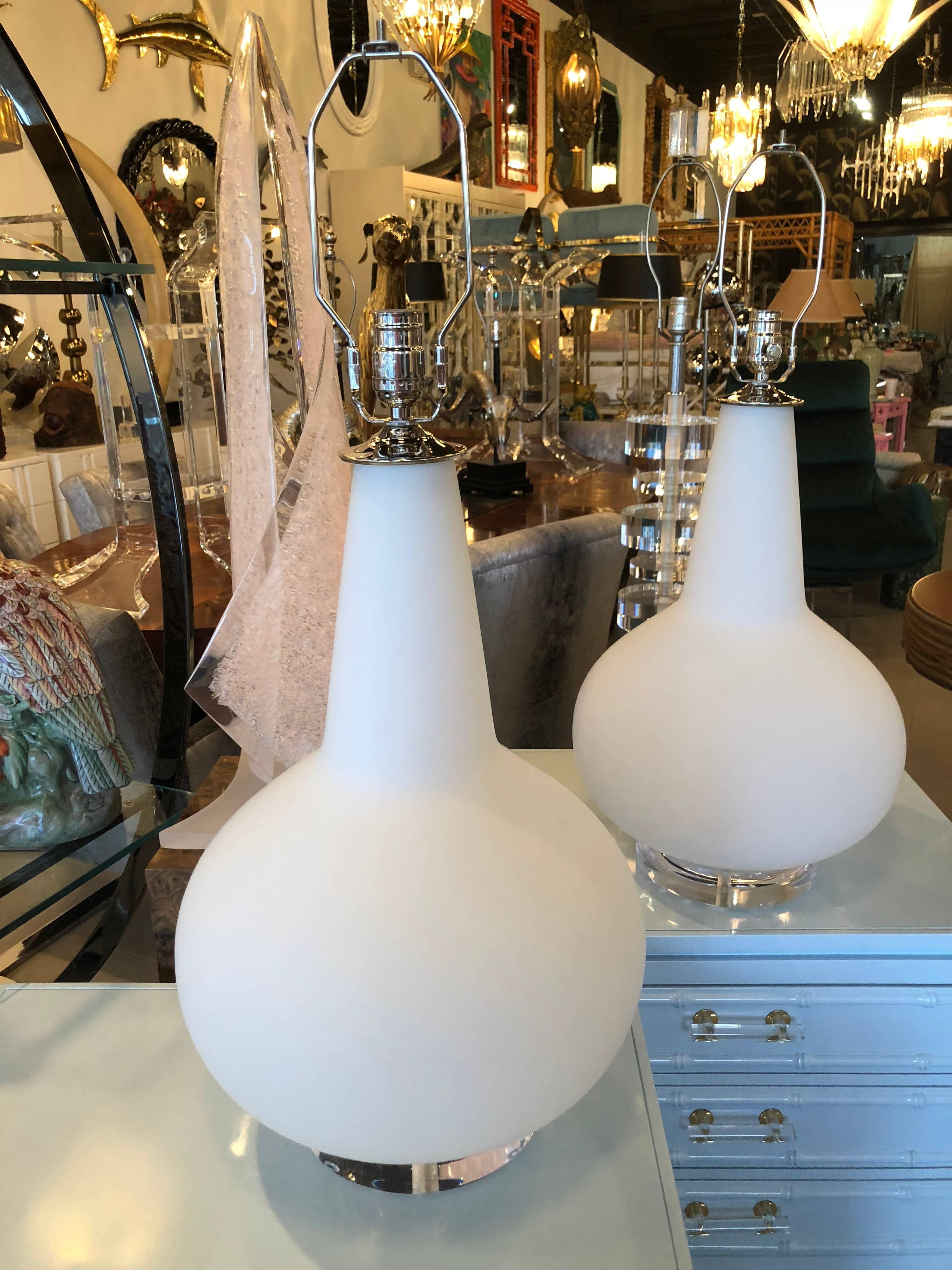 Amazing pair of vintage Italian Murano oversized table lamps, hand blown. Made in Italy tag remains on lamp and can be removed by buyer. Large Lucite base, newly wired, new chrome hardware. No chips or breaks. Height to top of harp is 30.5
