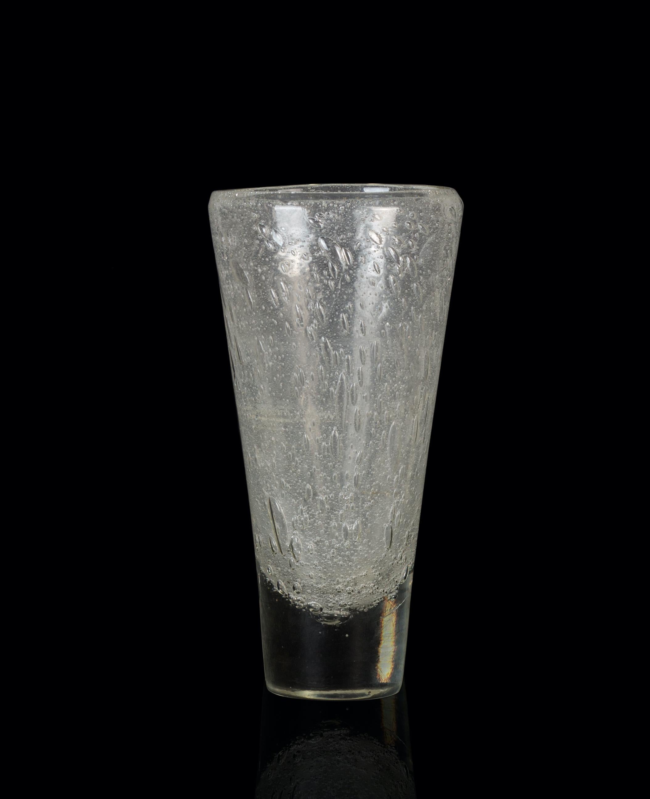 Blown glass vase is a beautiful glass decorative object, realized by an Italian manufacture during the 1970s. 

Very fashionable transparent vase realized with blown glass processing

Good conditions.