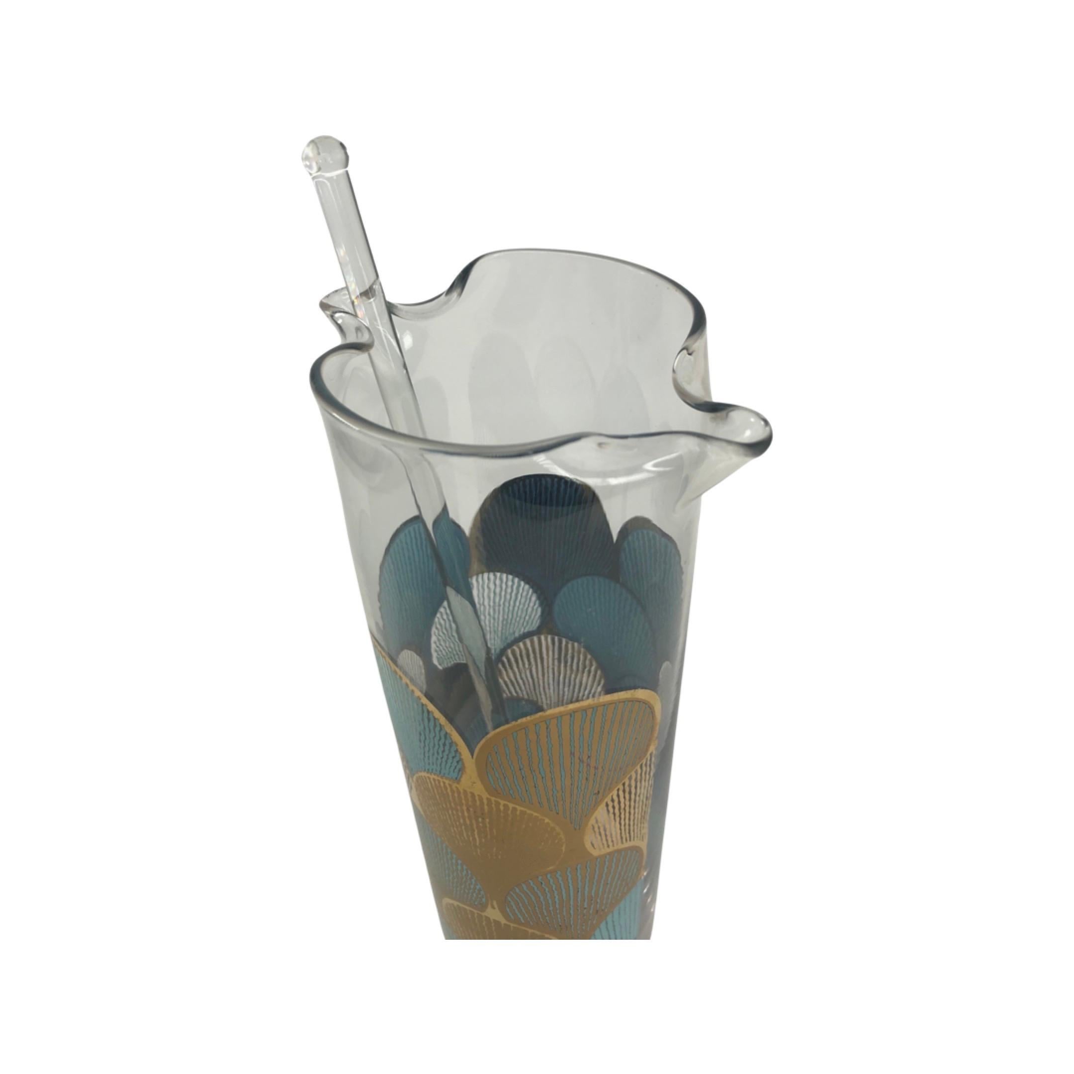  A fun vintage Cocktail Set with stylized shell motif design in light blue and gold decoration. Set comes with a large cocktail mixer or pitcher and a glass mixing rod, six single rocks glasses. A nice addition to any fun gathering. Glasses measure
