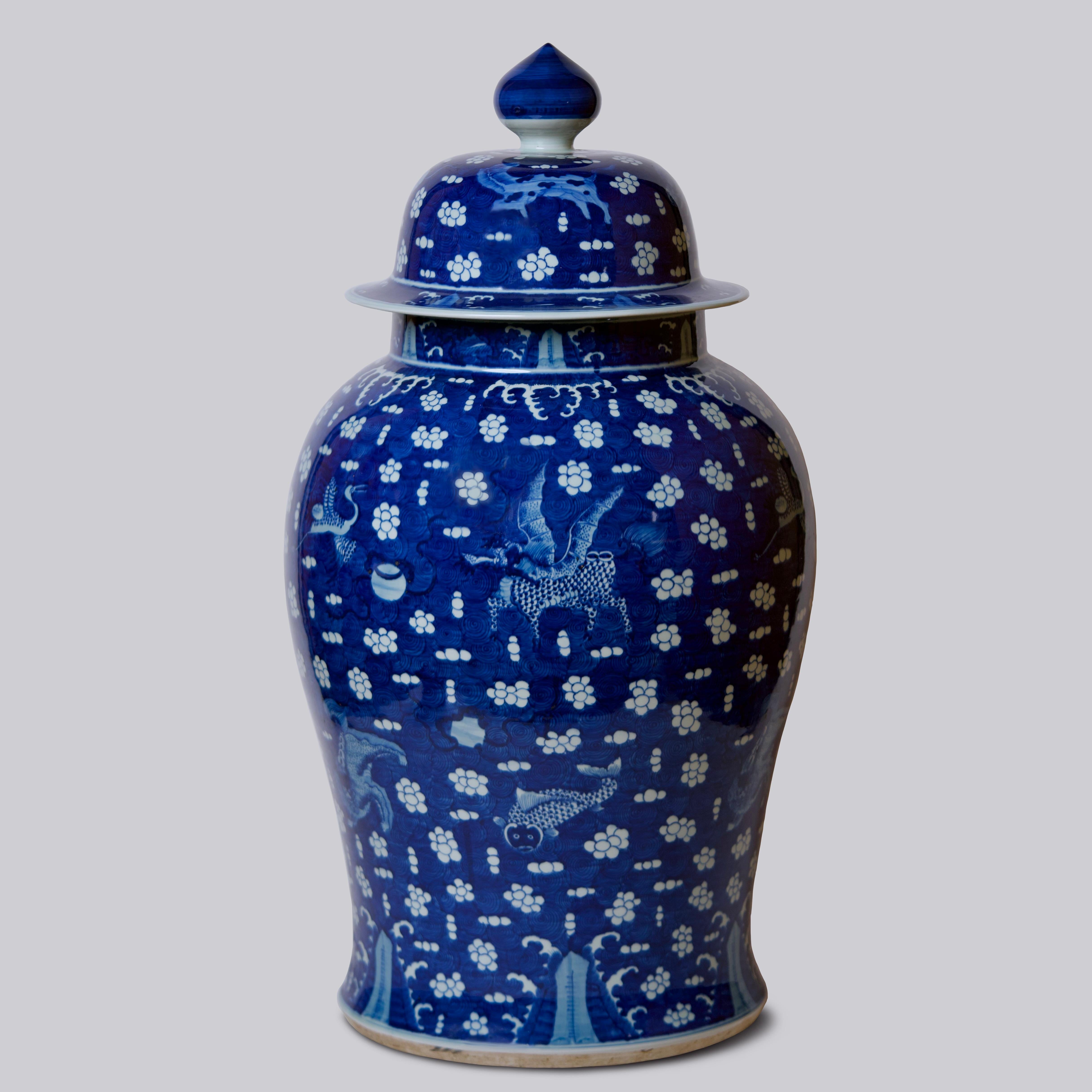 This temple jar is a traditional porcelain vessel from Jingdezhen, a town long distinguished by imperial patronage. An uncommon blue field with auspicious animals cavorting among the clouds sets this vase apart from the blue and white we most