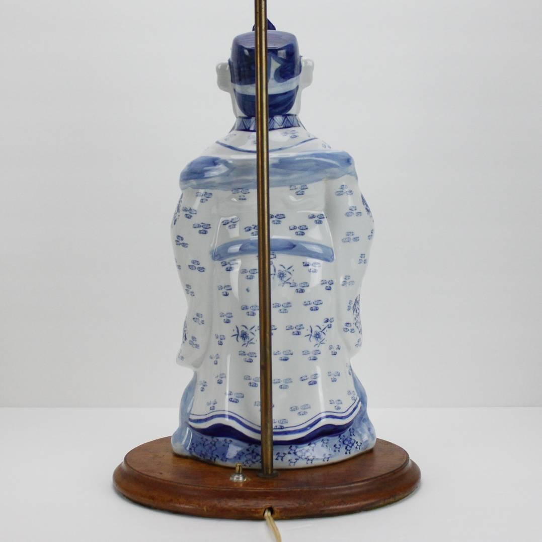 20th Century Vintage Blue and White Ceramic Chinese Figural Lamp For Sale