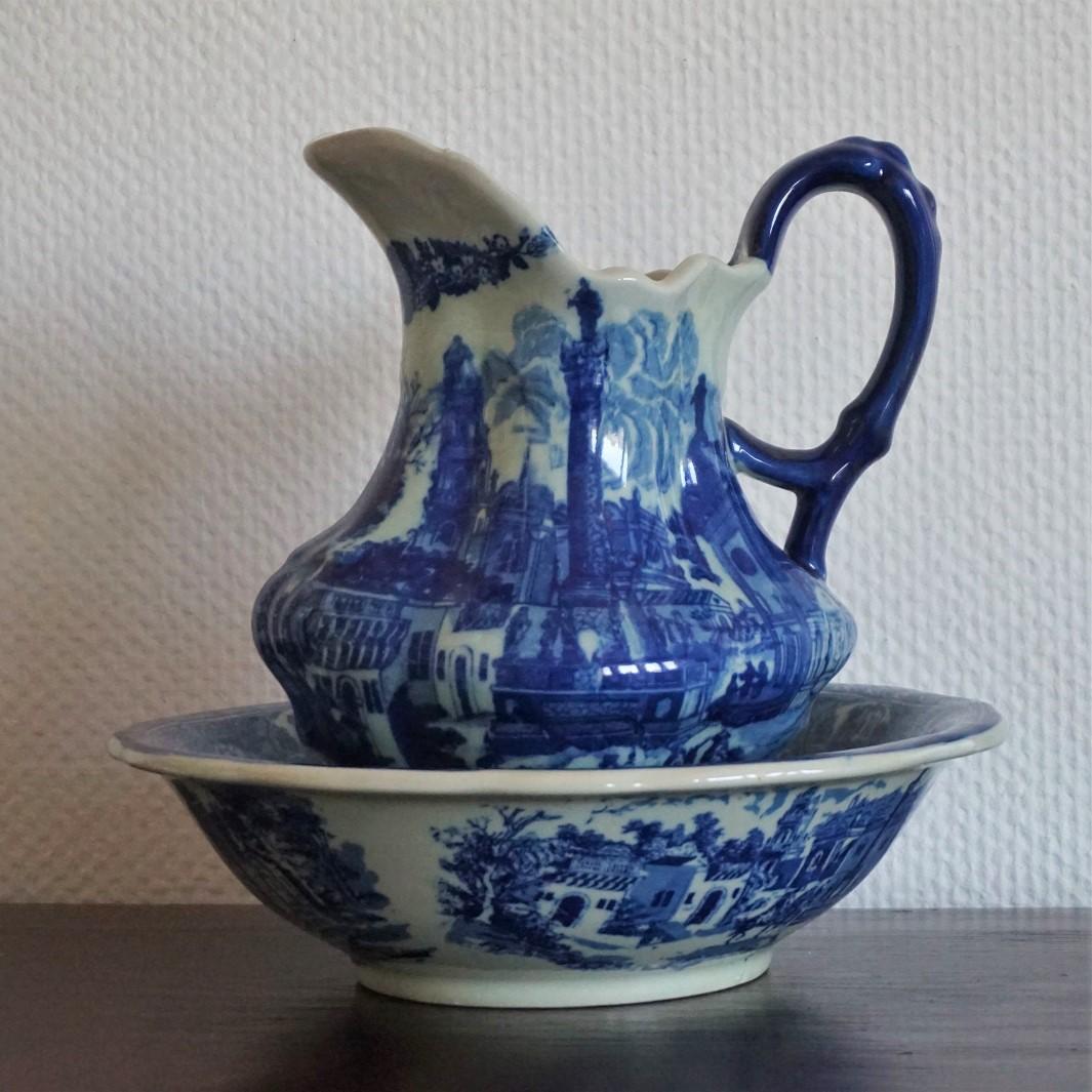 Large Vintage blue and white ceramic wash bowl and water pitcher richly decorated with beautiful motivs, circa 1970 - 1980. 
In very good condition, colour very well preserved, no chips or cracks.
Dimensions:
Pitcher: Width 10