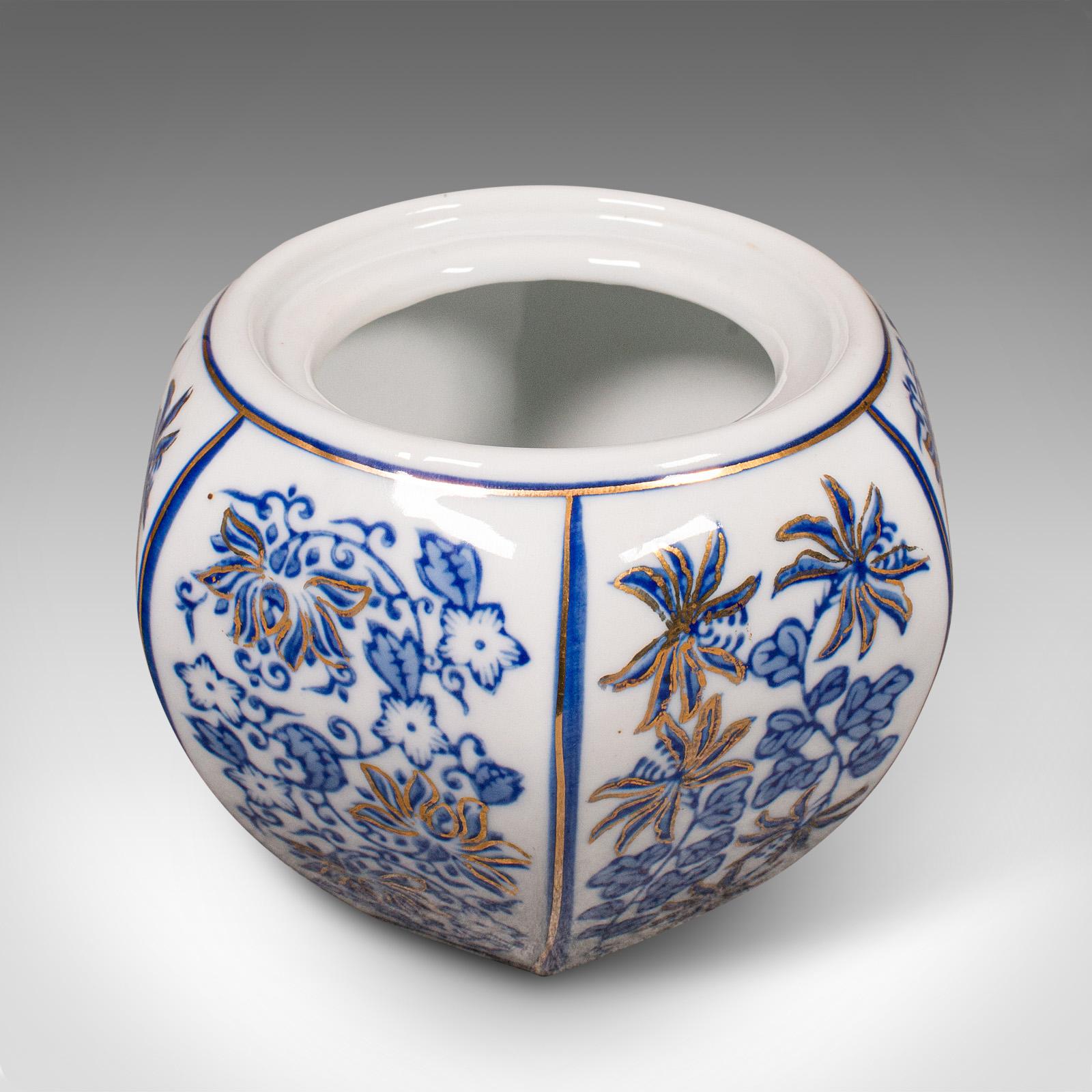 This is a vintage blue and white spice jar. A Chinese, ceramic decorative pot, dating to the late Art Deco period, circa 1940.

Appealing in colour and form, with a charming decorative appearance
Displays a desirable aged patina throughout
White