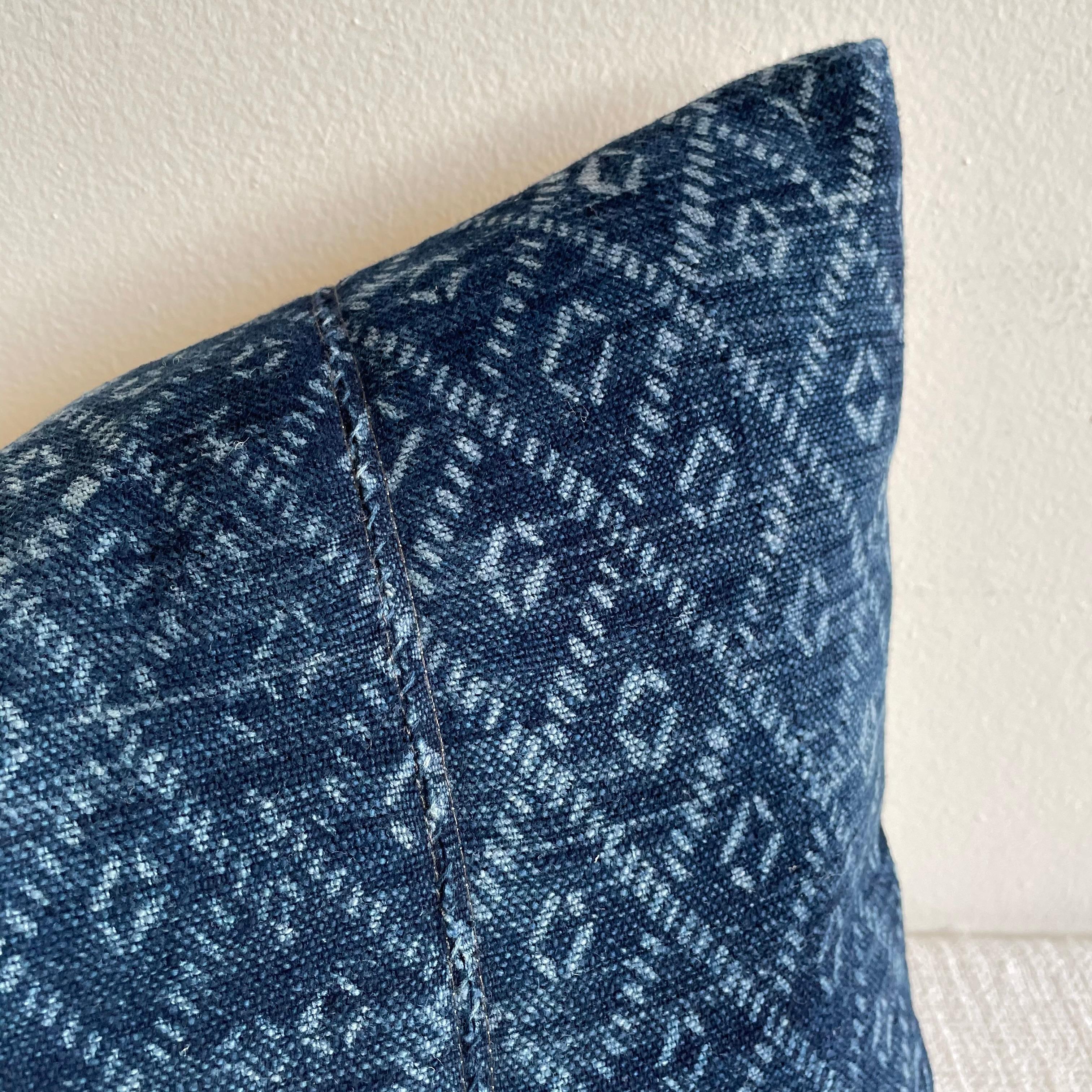 Vintage blue batik lumbar pillow with down feather insert.
This vintage textile pillow face features an antique batik fabric. The backing is 100% Belgian linen in natural linen. Our pillows are constructed with vintage one of a kind textiles from