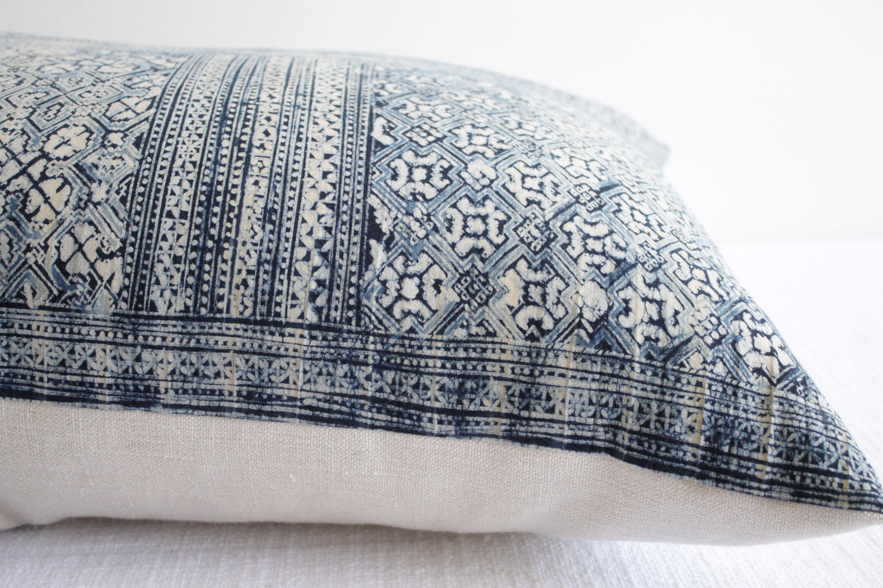 The face is a vintage soft silky textured batik, in indigo blue with natural colored designs. The back is a 100% pure Irish Linen in our color sand. Our pillows are constructed with vintage one of a kind textiles from around the globe. Carefully