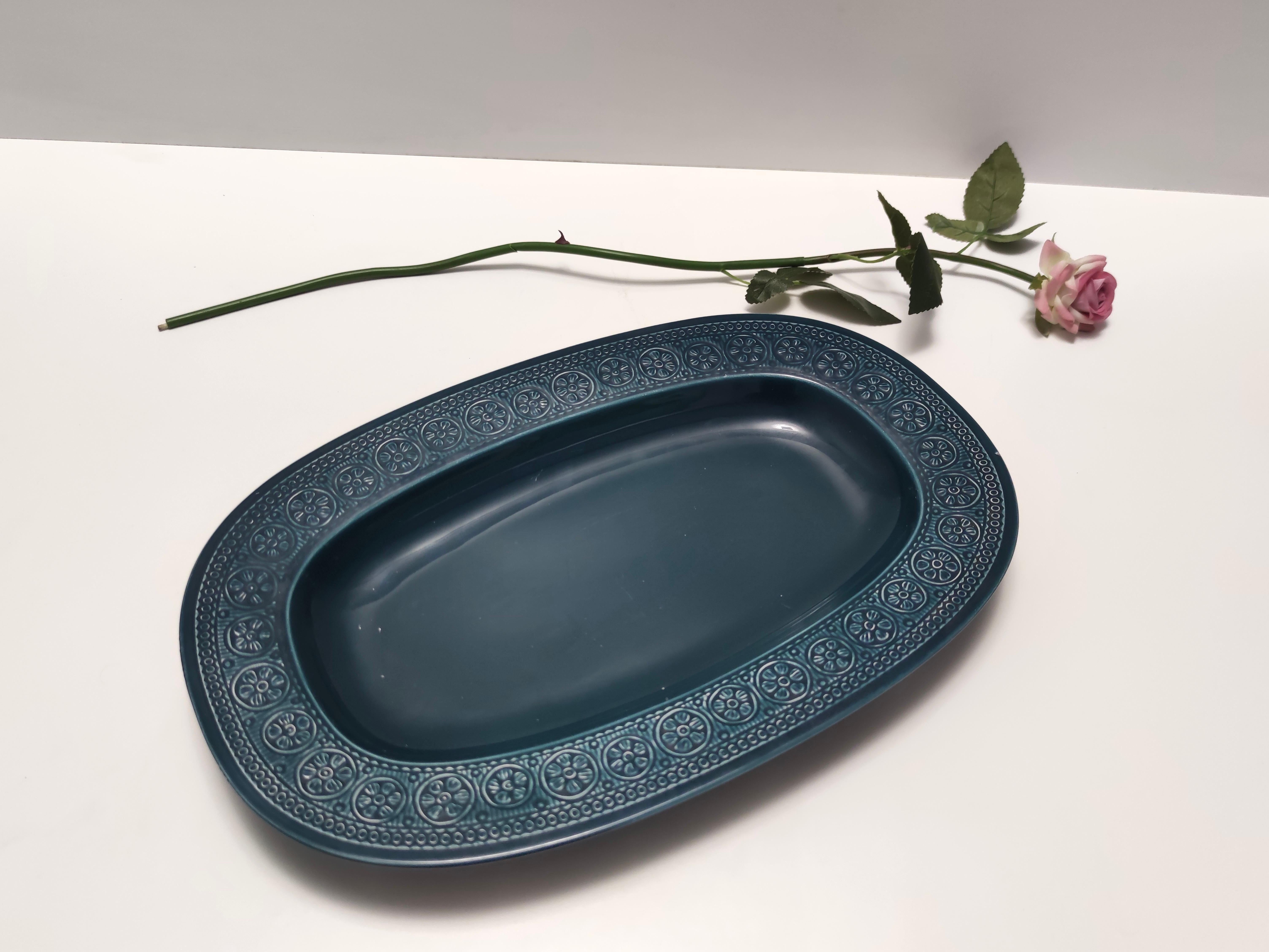 Made in Italy in 1965 by Antonia Campi for Laveno. It is marked on the bottom. 
This tray is made in blue lacquered earthenware with bossed decorations.
It is a vintage item, therefore it might show slight traces of use, but it can be considered as
