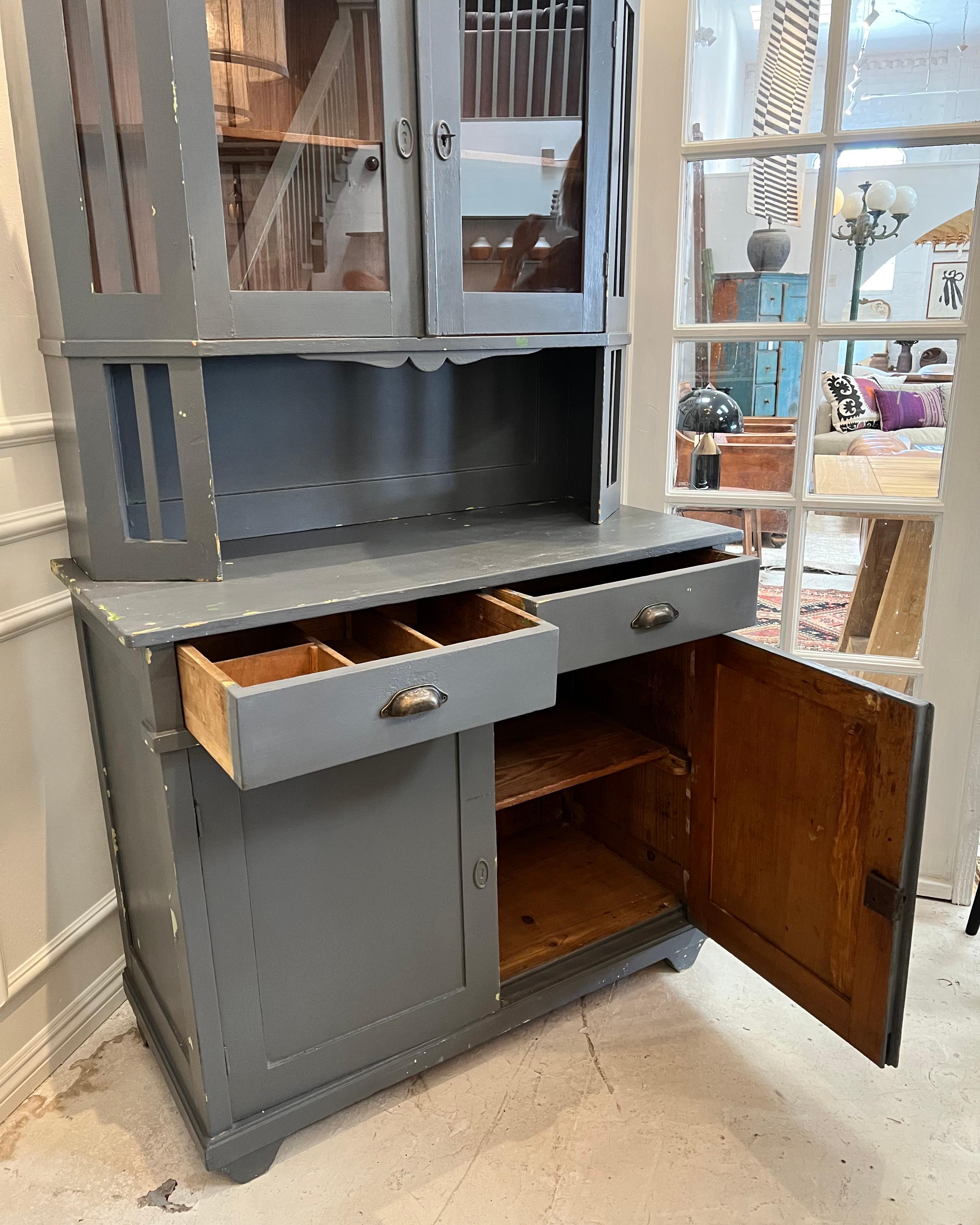 Vintage French handcrafted cabinet with Hutch, an unique design featuring glass doors.