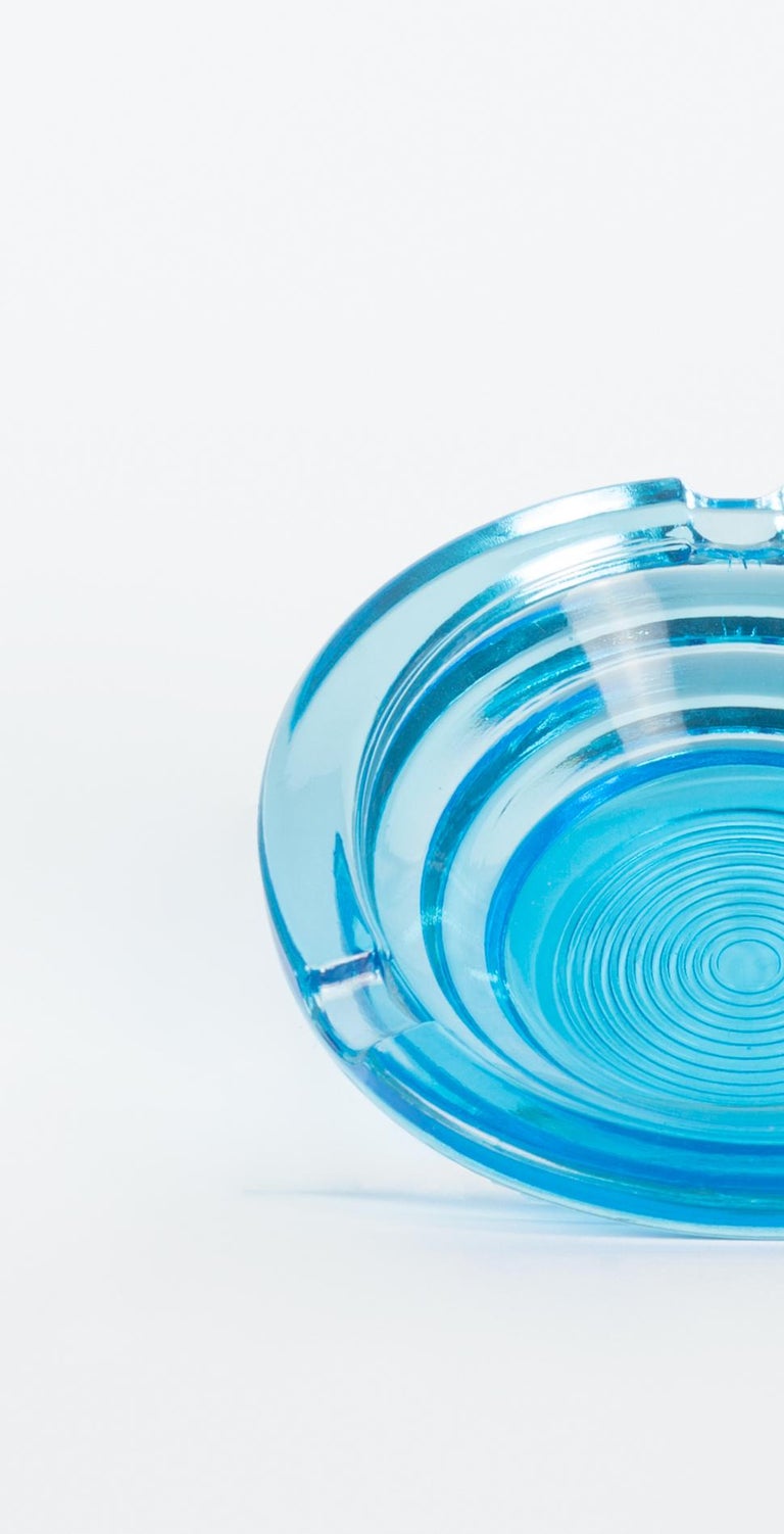Glass blue ashtray is an elegant glass decorative object, realized during the 1970s.

Very elegant glass ashtray round shape and brilliant blue colored.

Good conditions.