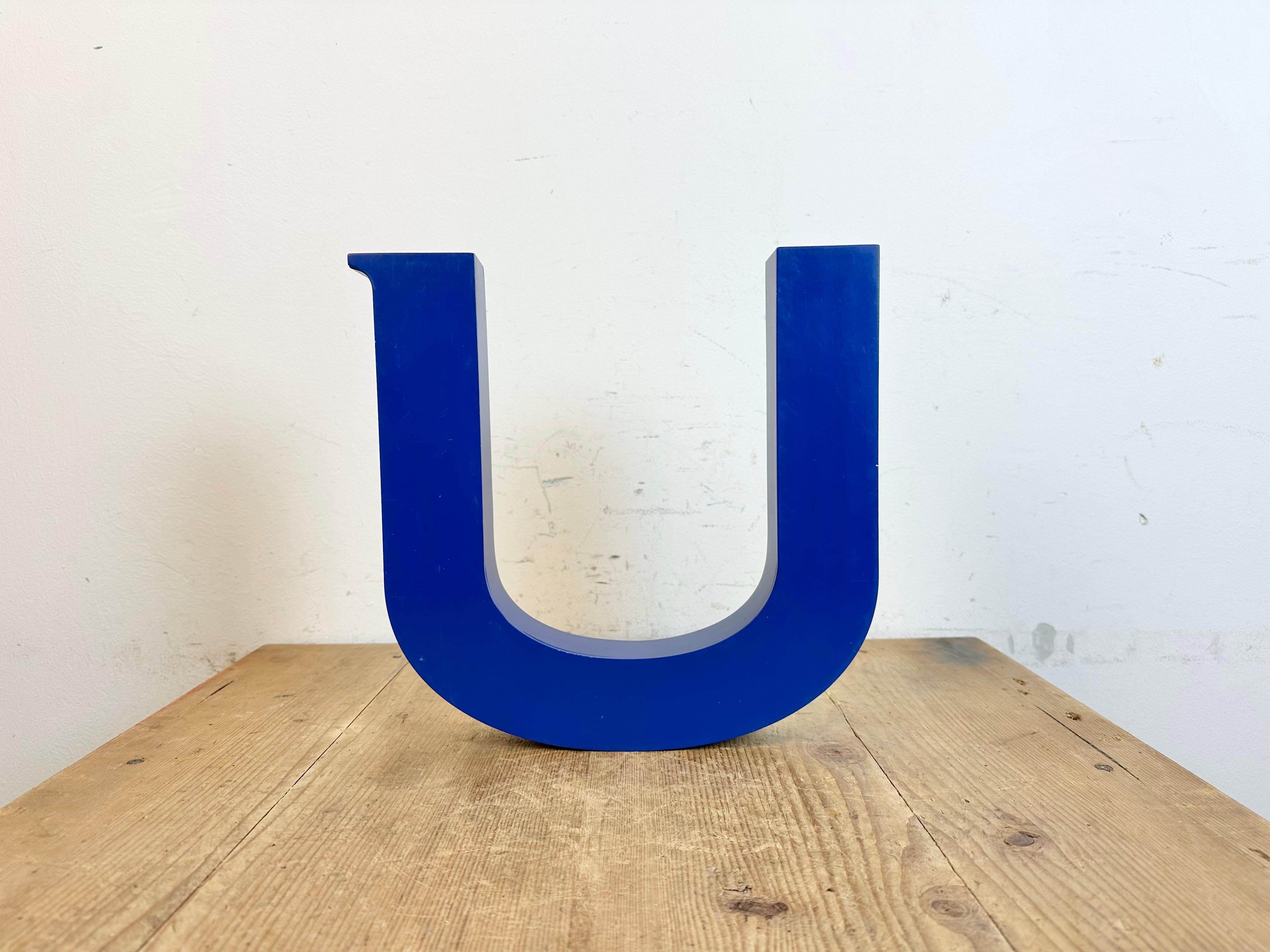This vintage industrial facade letter “U” was made during the 1970s in Italy and comes from an old advertising banner. The weight of the letter is 0,8 kg.