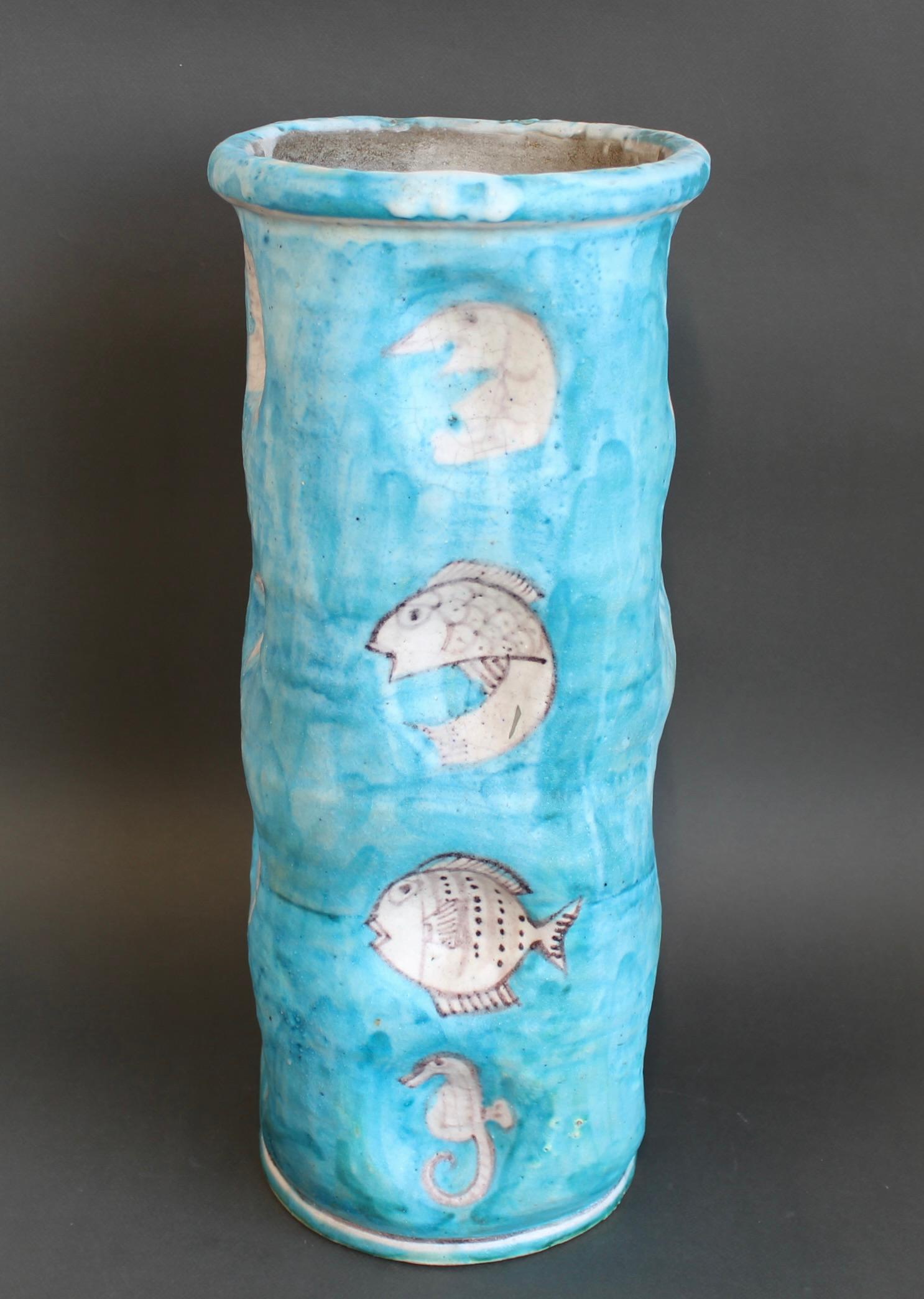 Vintage Blue ceramic umbrella holder by C.A.S. Vietri (circa 1950s). In the style of Guido Gambone, this impressive piece features a delightful sea creatures motif. The structure is vibrant turquoise, somewhat muted with age, with accents not unlike
