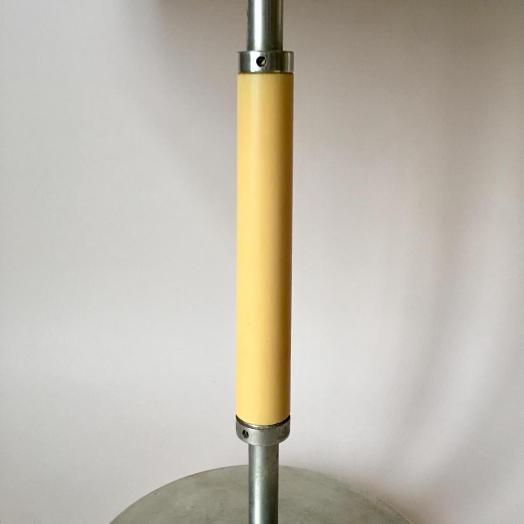 This desk lamp features blue painted metal shade with two bulbs and steel base with plastic central part.