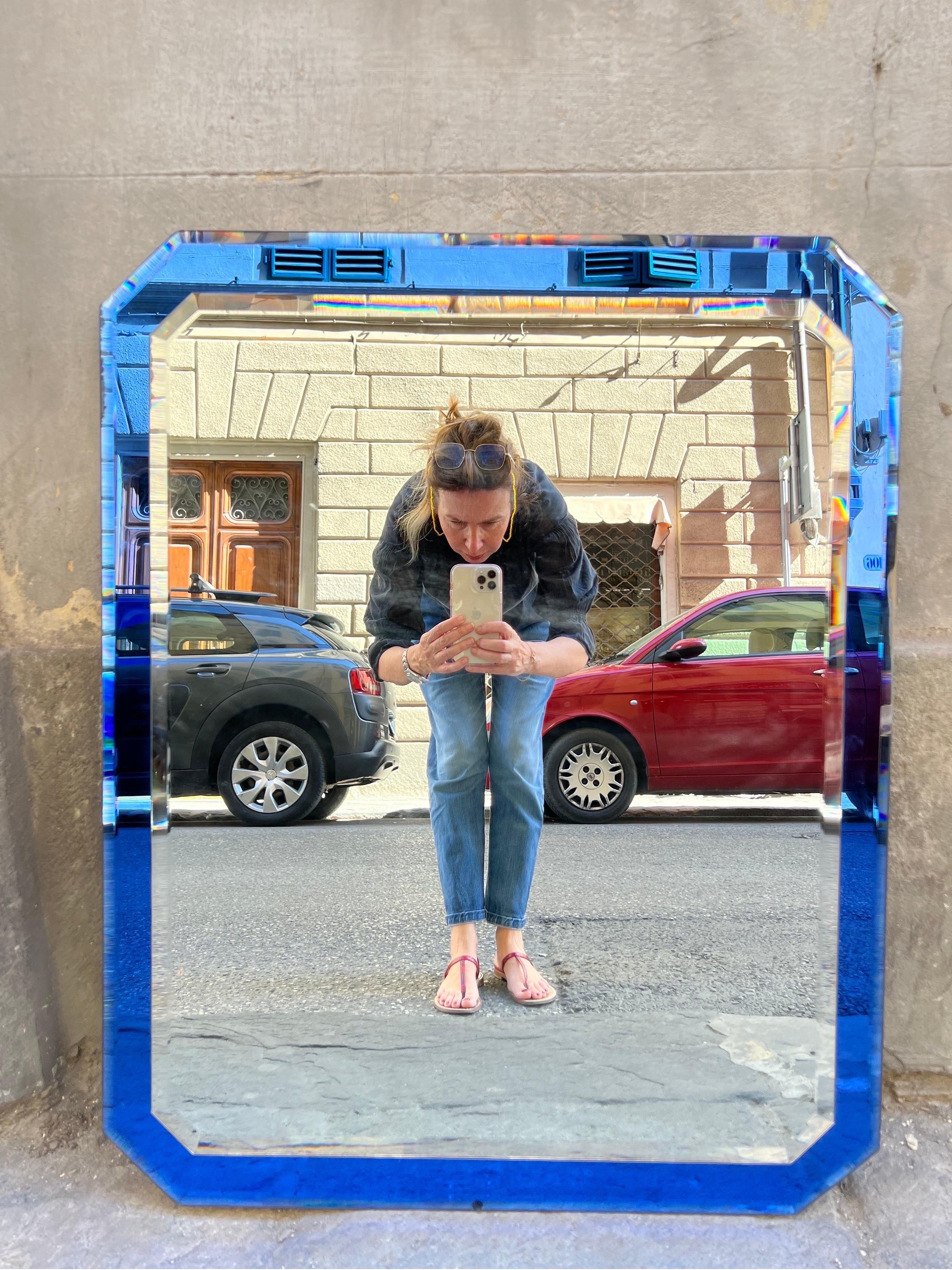 Italian Vintage Blue Murano glass frame mirror with beleved edges, attributed to Fontana Arte.
Can be hung horizontally or vertically.