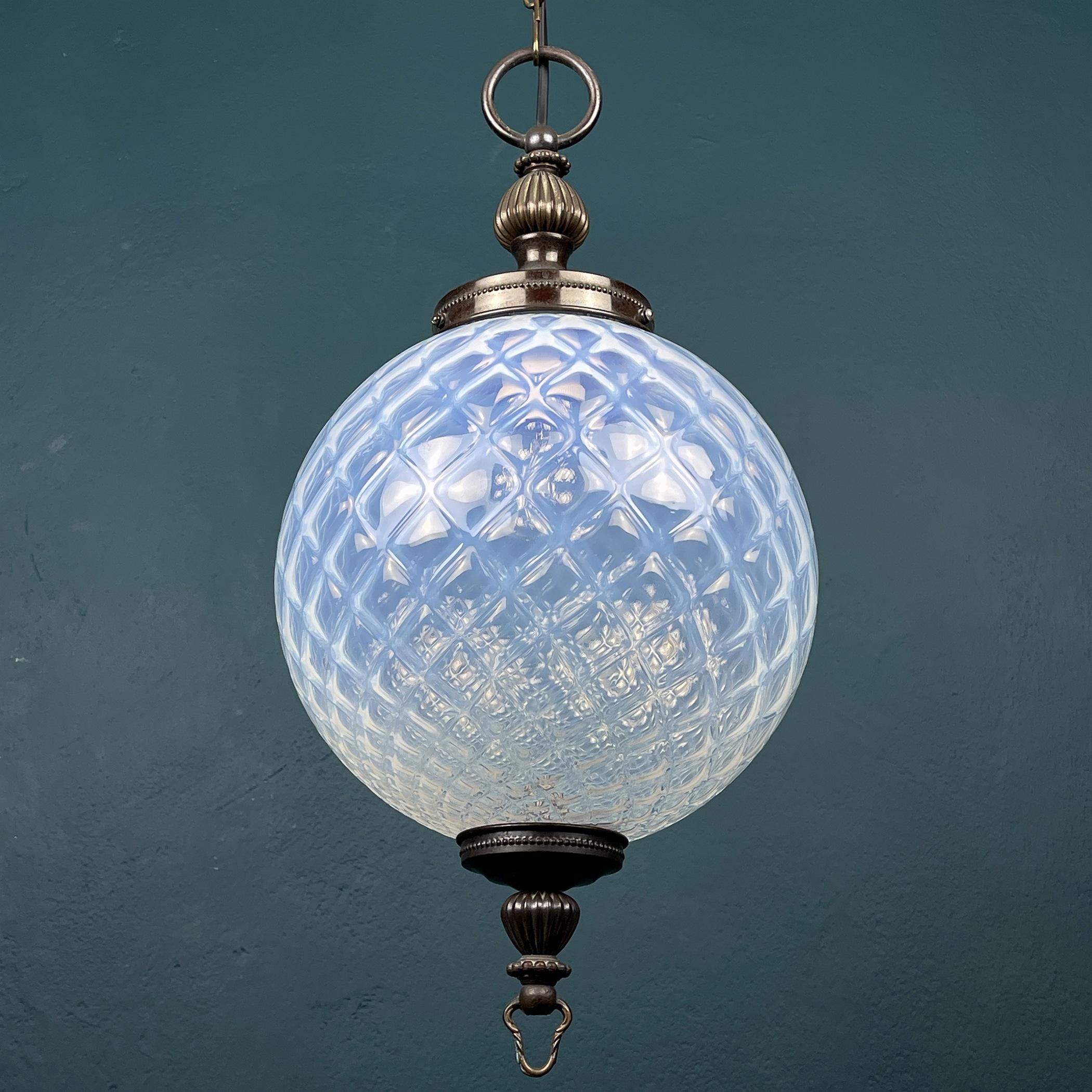 Vintage blue murano ball pendant lamp made in Italy in the 1970s. It gives off soft and soothing light when lit and brightens the room beautifully. It will undoubtedly decorate your home. In very good vintage condition, no damage. Requires E27