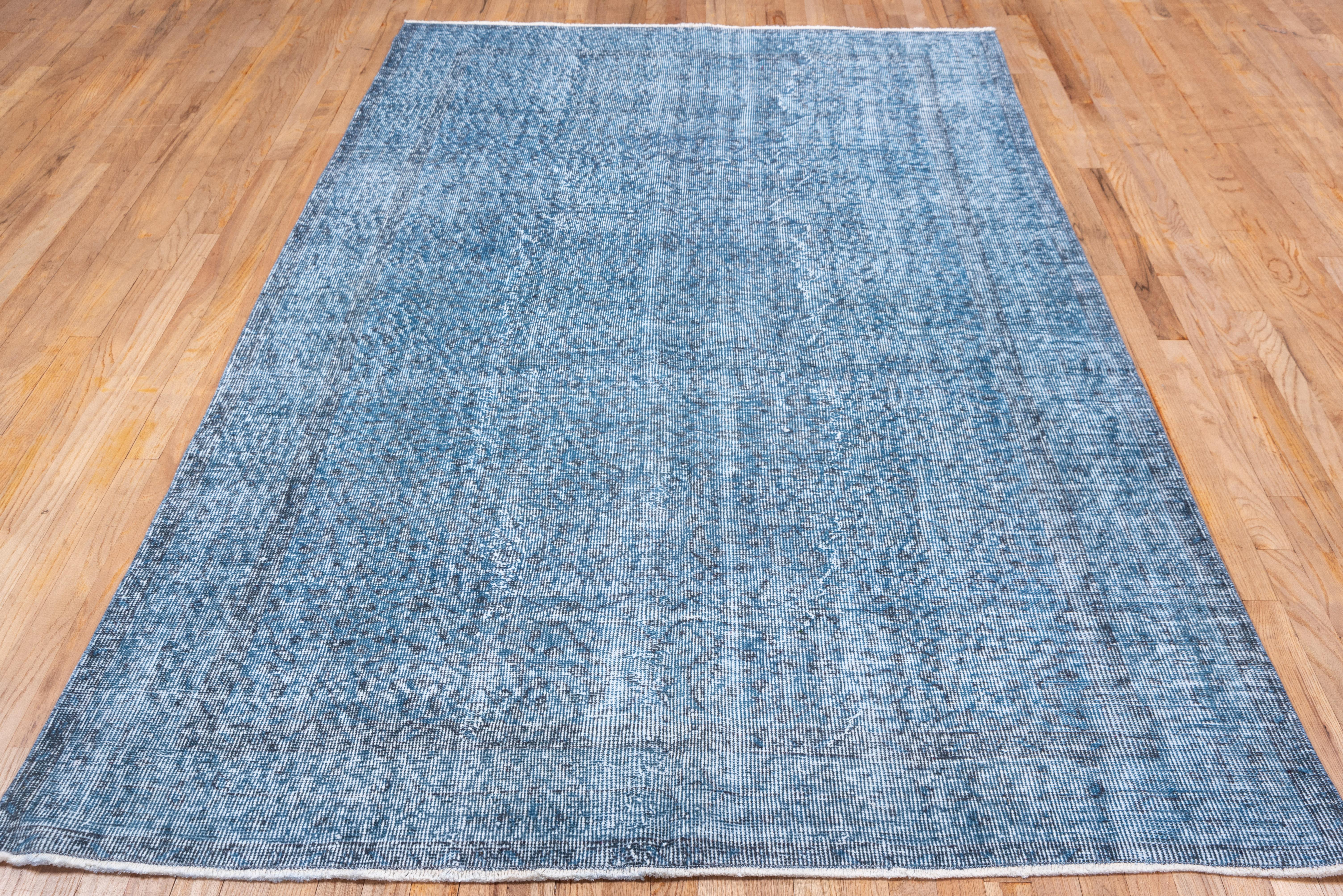 This bright blue Turkish overdye carpet has a pattern defined by the wear beyond the all-over general distress. Vertical and horizontal off white strips cross near the center. Shabby chic conditions and can offer some great texture for floor