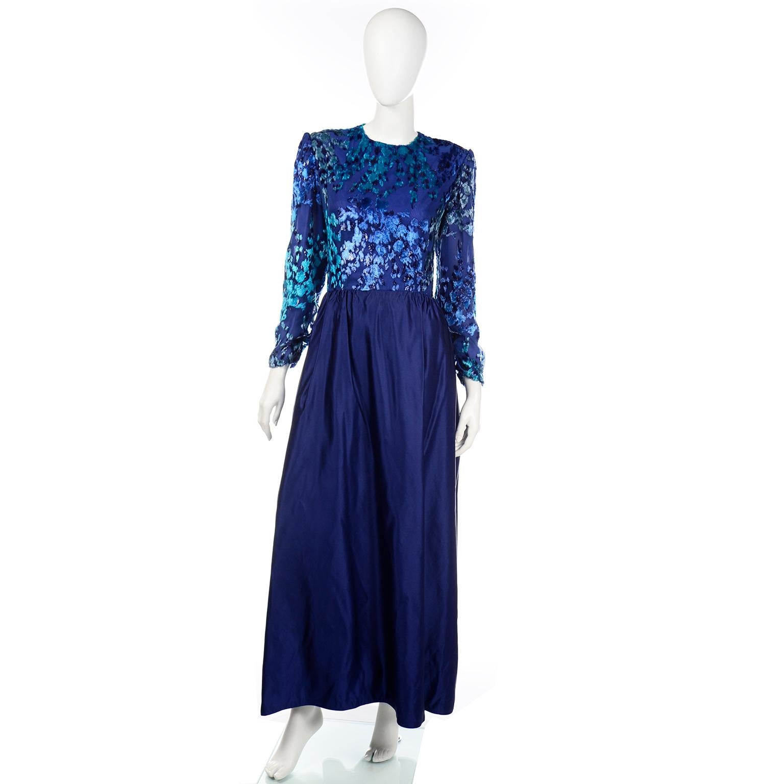 This is a really elegant vintage Richilene evening gown with a blue taffeta skirt and a gorgeous burnout velvet bodice in pretty shades of blue. We love the ever so slight metallic threads that give the bodice a just the right amount of glistening 