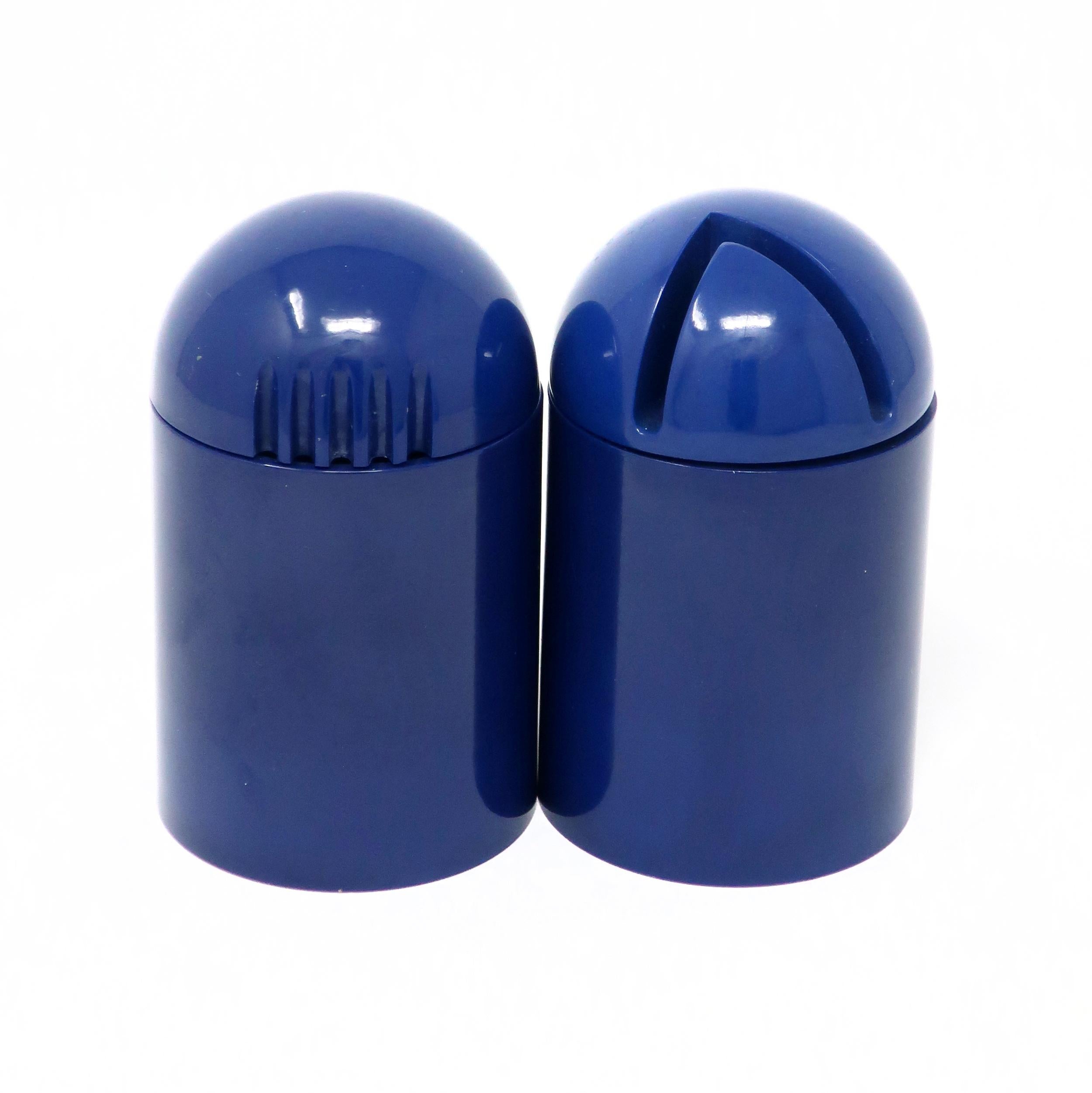 Originally designed by Enzo Mari (a prolific Italian industrial and furniture design master) for Danese Milano, this set of blue plastic pepper grinder and salt shaker were designed in 1969 and 1972, respectively, and made by Alessi, the Italian