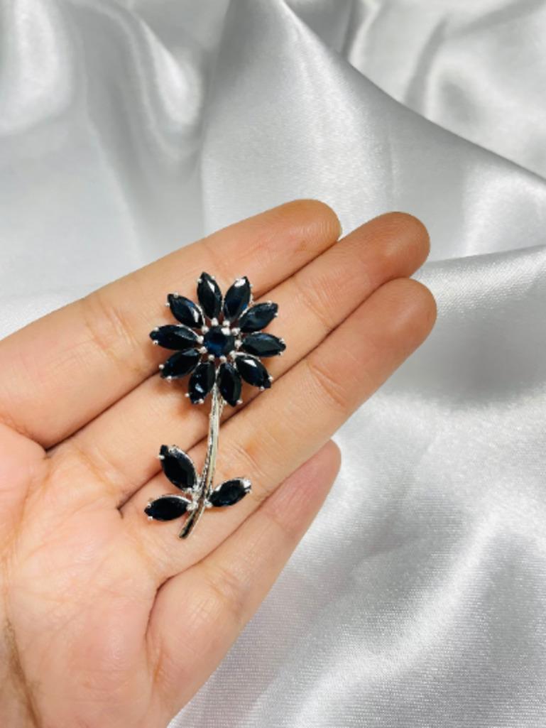 This Blue Sapphire Sunflower Brooch enhances your attire and is perfect for adding a touch of elegance and charm to any outfit. Crafted with exquisite craftsmanship and adorned with dazzling sapphire which helps in relieving stress, anxiety and