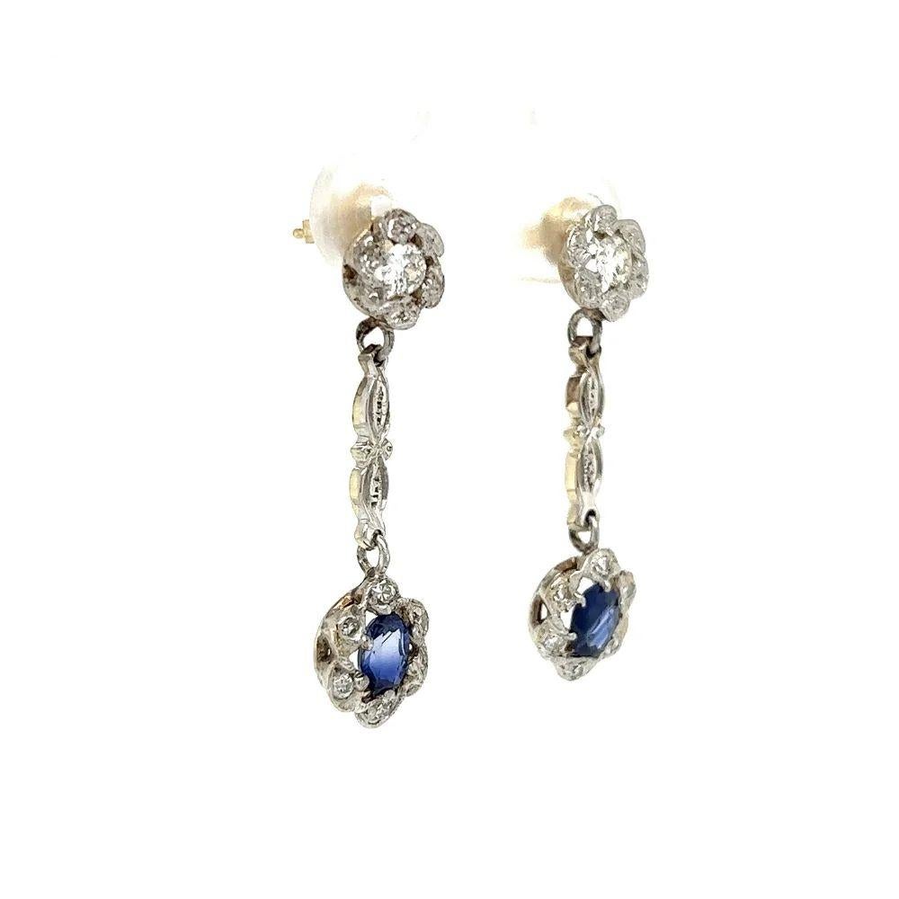 Vintage Blue Sapphire and Diamond Gold Drop Earrings Simply Beautiful! Each drop earring is securely hand set with an Oval Natural Blue Sapphire. Approx. weight of 2 Sapphires is 0.75tcw. Surrounded by Diamonds, approx. 0.35tcw. Hand crafted 14K
