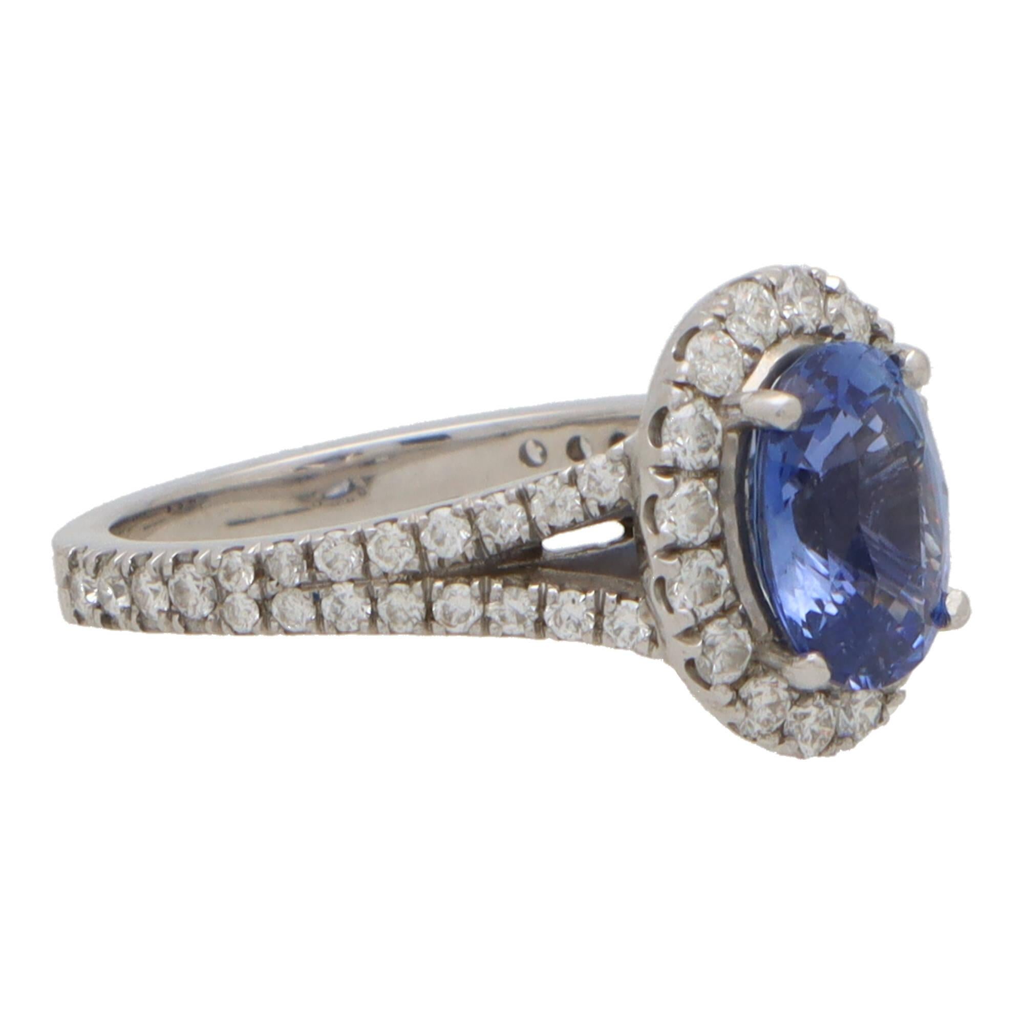 Modern Vintage Blue Sapphire and Diamond Oval Halo Cluster Ring For Sale