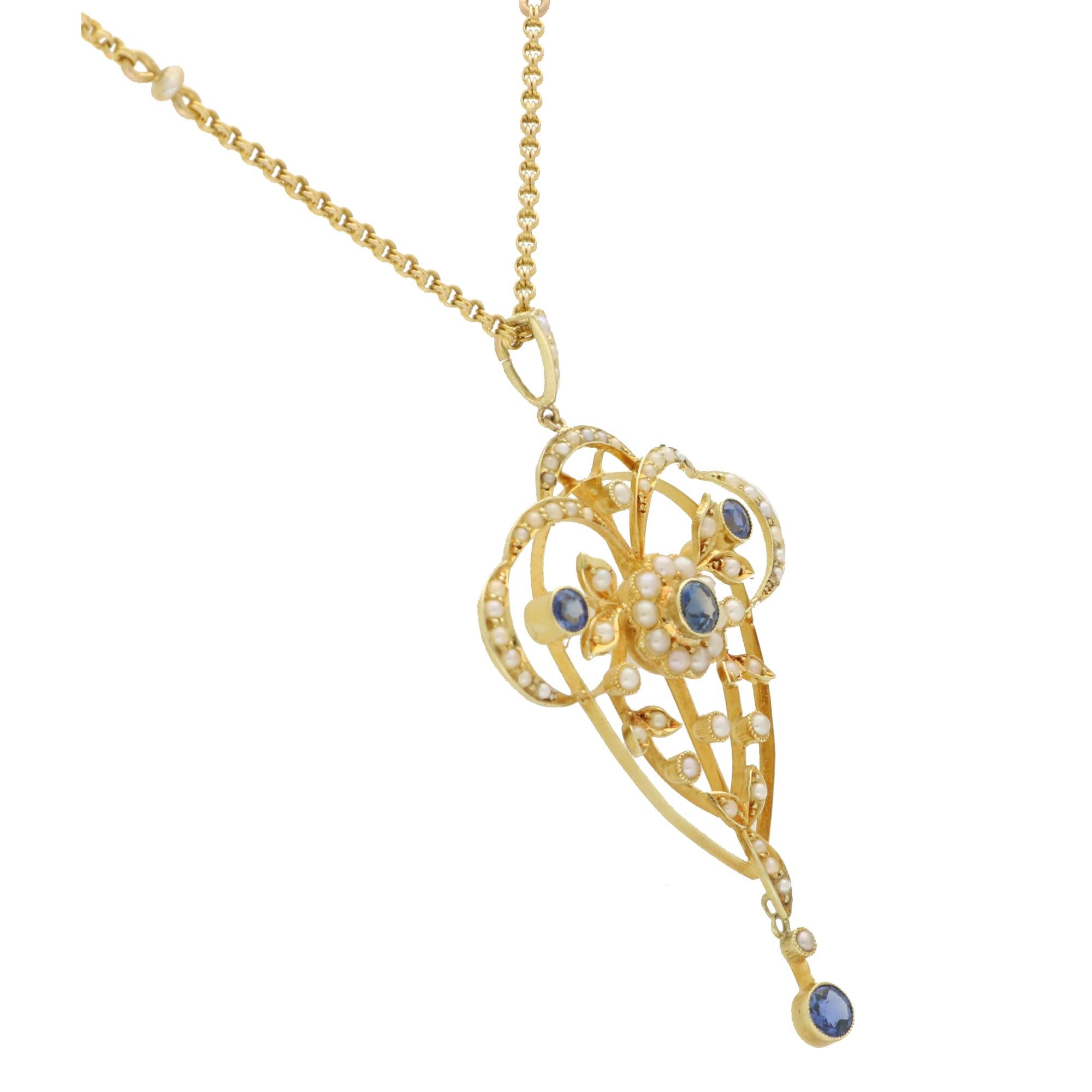 A beautiful vintage blue sapphire and seed pearl necklace set in 15k yellow gold.

The piece features an intricate floral motif, set with four round cut cornflower blue sapphires and an array of cream coloured seed pearls. The contrast of the blue