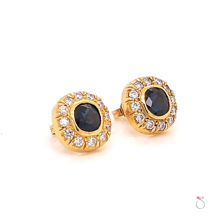 Gorgeous natural Blue Sapphire & Diamond cushion halo stud Earrings in 18K yellow gold. These beautiful Earrings feature Two cushion cut blue Sapphires bezel set in and surrounded by a diamond halo. The sapphires measure approximately 5.60 x 5.60 mm