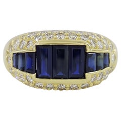 18 Karat Gelbgold Ring mit blauem Saphir und rundem Diamant