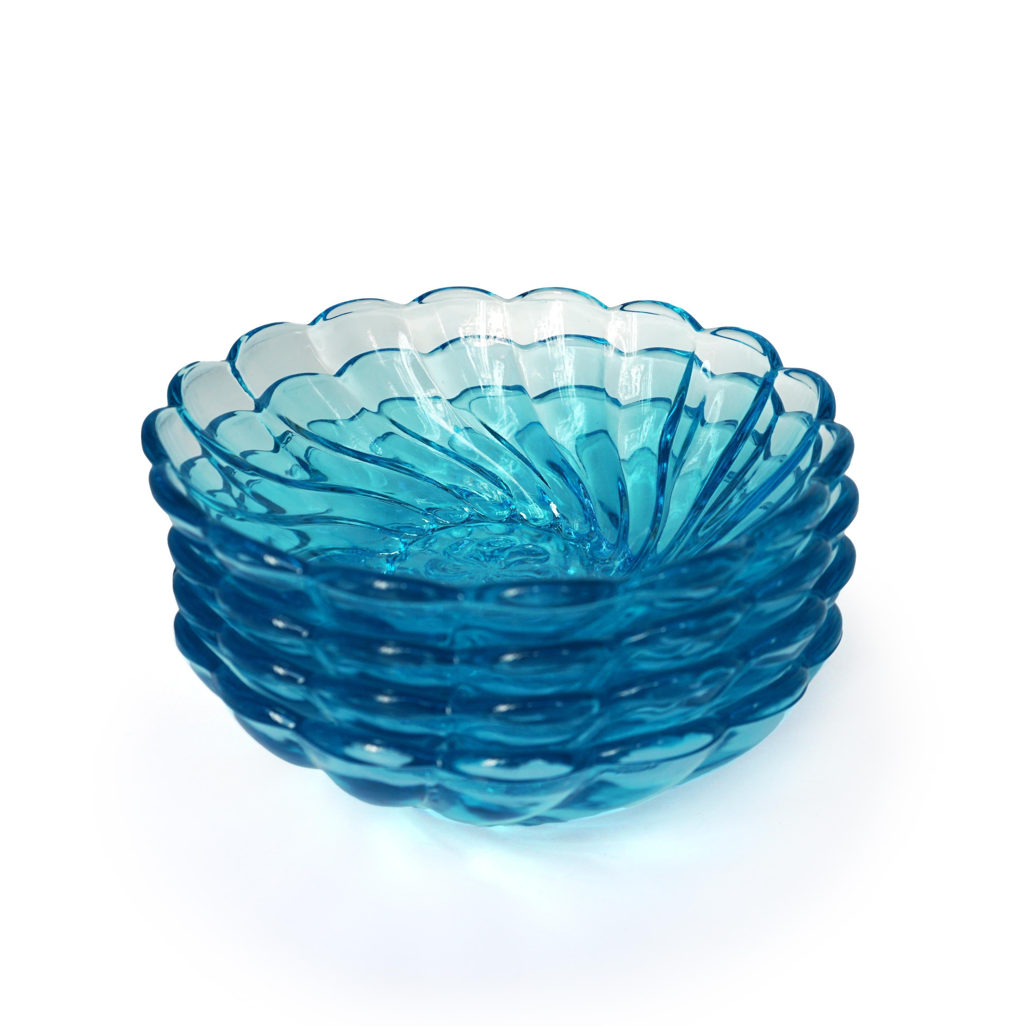 Vintage blue Seachell Swirl small bowls Set, 1960s 

Glass
Measures: 4.75 x 1.75 in.

A set of 4 small vintage blue glass bowls. Soft swirls adorn the exterior of the pieces.



All sales are final.
  