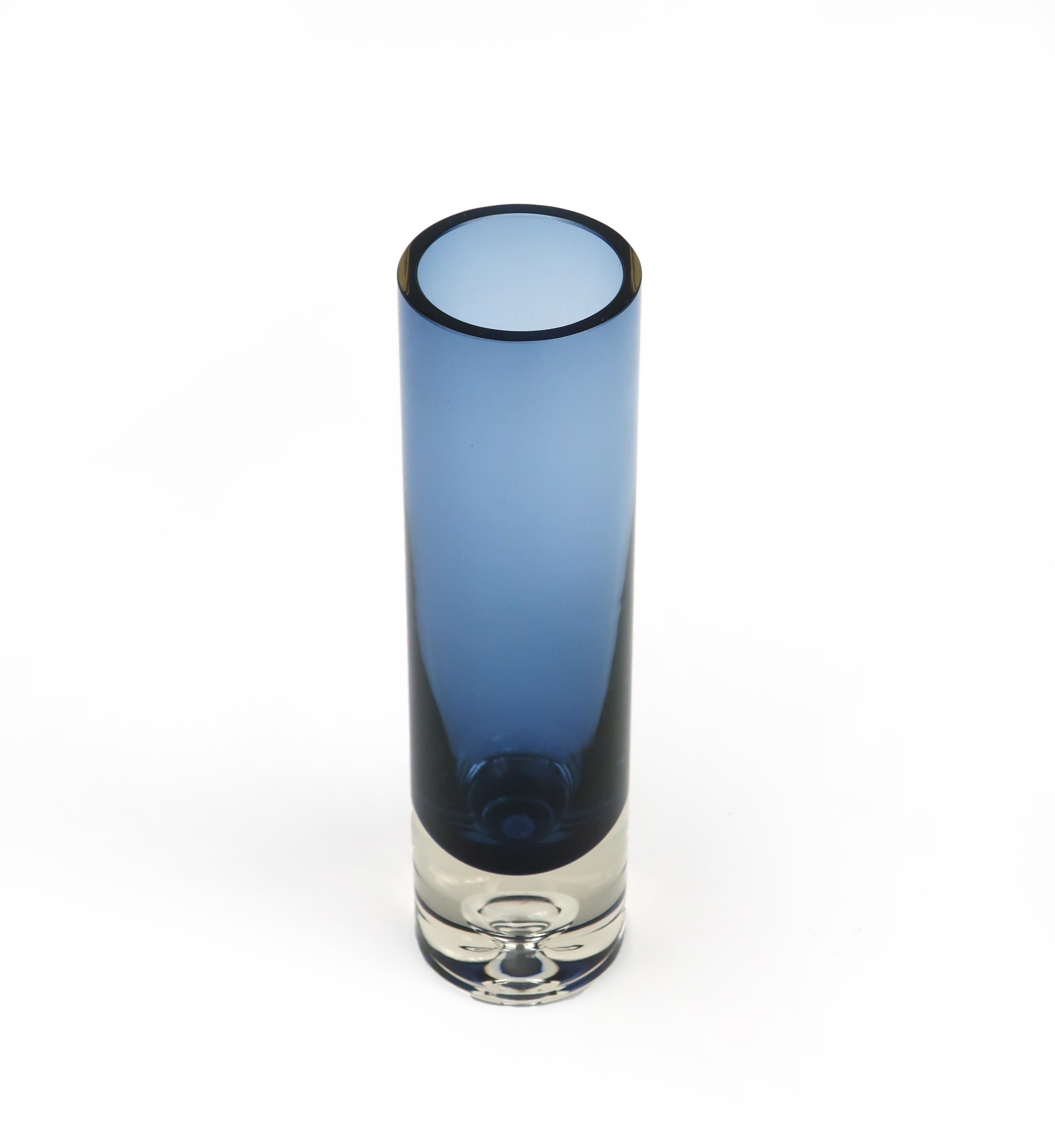 Tapio Wirkkala designed hundred of pieces for Iittala, the great Finnish glass and housewares company. This blue glass vase with a clear base include a distinctive droplet decoration inside the foot. Signed on base.
 