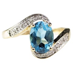 Vintage Blue Topaz and Diamond crossover ring, 9k gold 