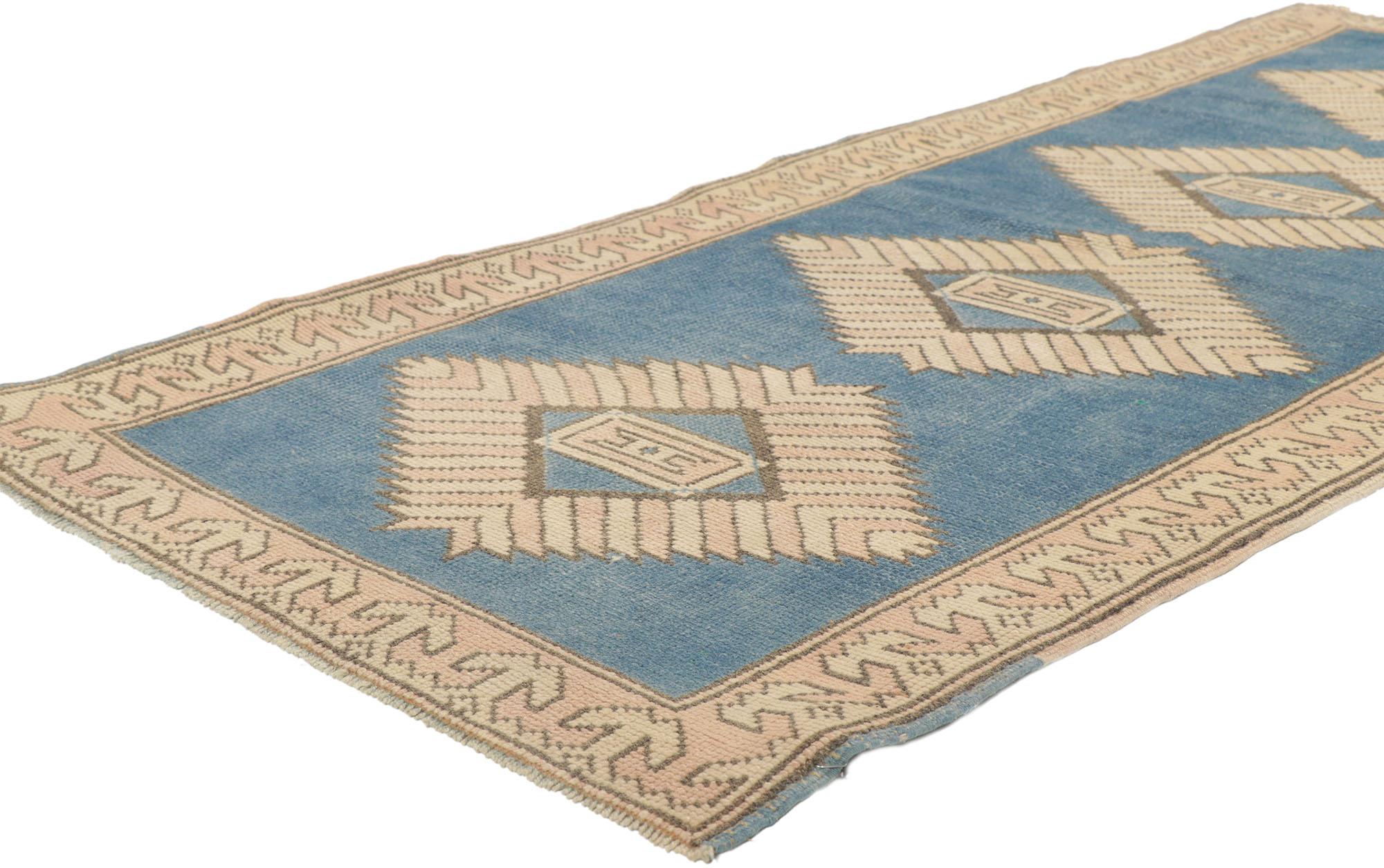 53721 Vintage Turkish Oushak Rug, 02'07 x 06'00.
Modern boho chic meets sophisticated nomad in this hand knotted wool vintage Turkish Oushak rug. Soft pink and radiant blue hues meld with cozy tan tones unite in a tribal dance of color, resulting in