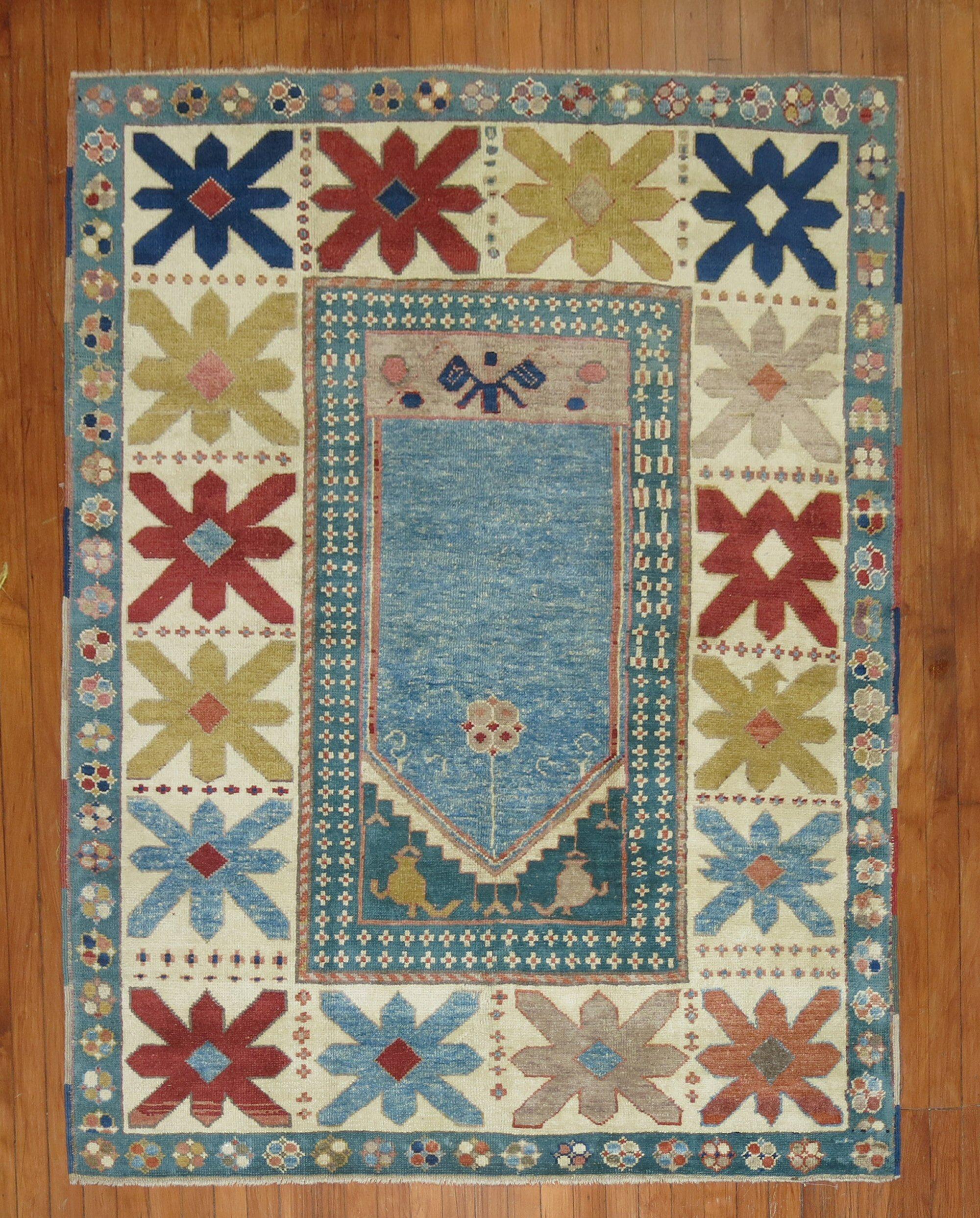 A late 20th-century Turkish Konya Rug with a prayer niche design on a blue field

Measures: 4'9'' x 6'1''.