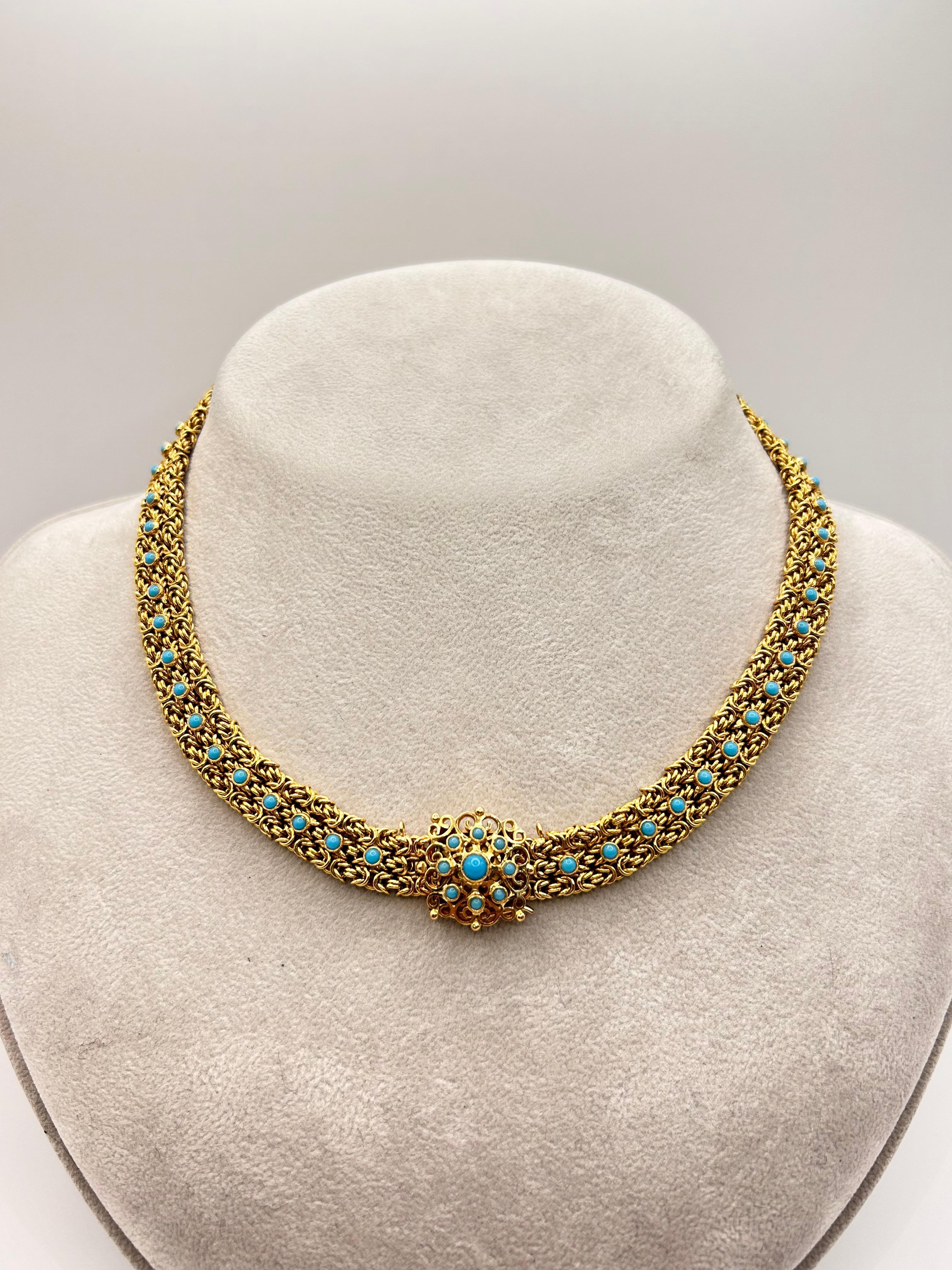 Vintage 19 karat yellow gold woven necklace set with round blue Turquoise.  
Portugal circa 1950.