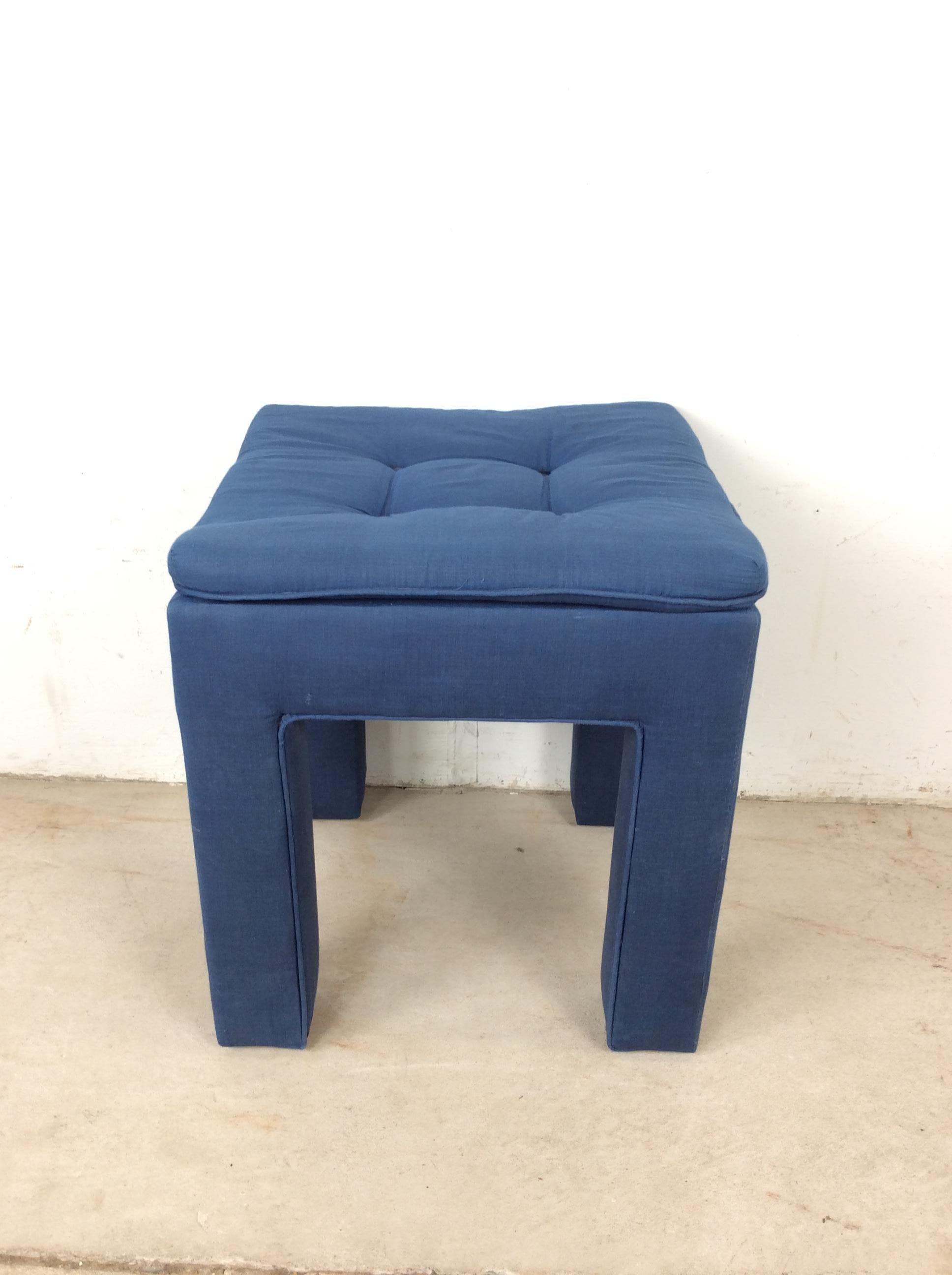 This vintage parson style foot rest / ottoman features original blue upholstery, tufted seat, and upholstered legs.

Dimensions: 19w 19d 20h 20sh  

Condition notes: Original vintage upholstery shows some wear, the tufted seat buttons are intact. No