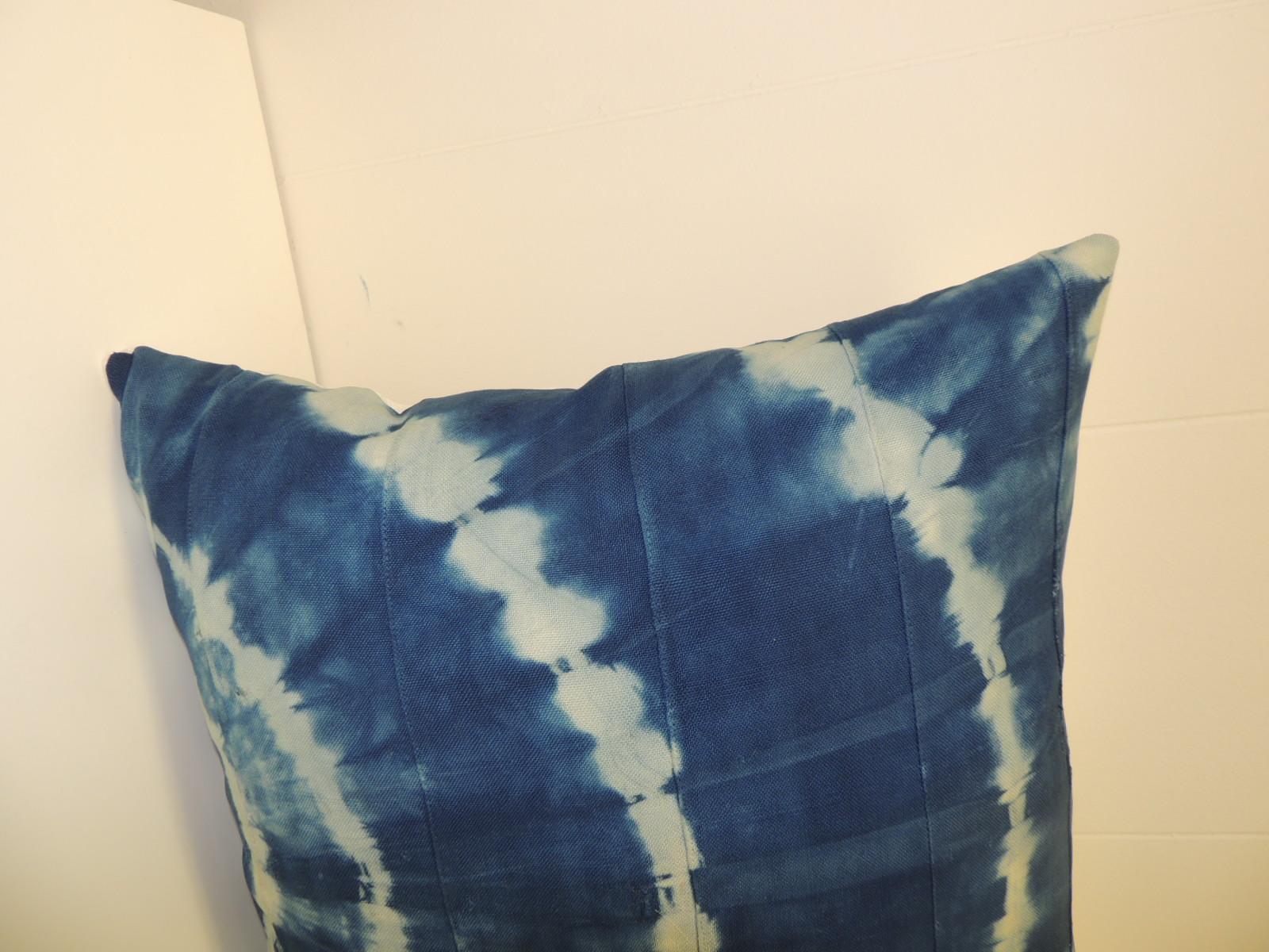 Vintage Indigo and White African Resist-dye Textile Decorative Pillow
Sunburst pattern square pillow with textured white silk backing.
Decorative pillow handmade and designed in the USA. 
Closure by stitch (no zipper) with custom made feather/down