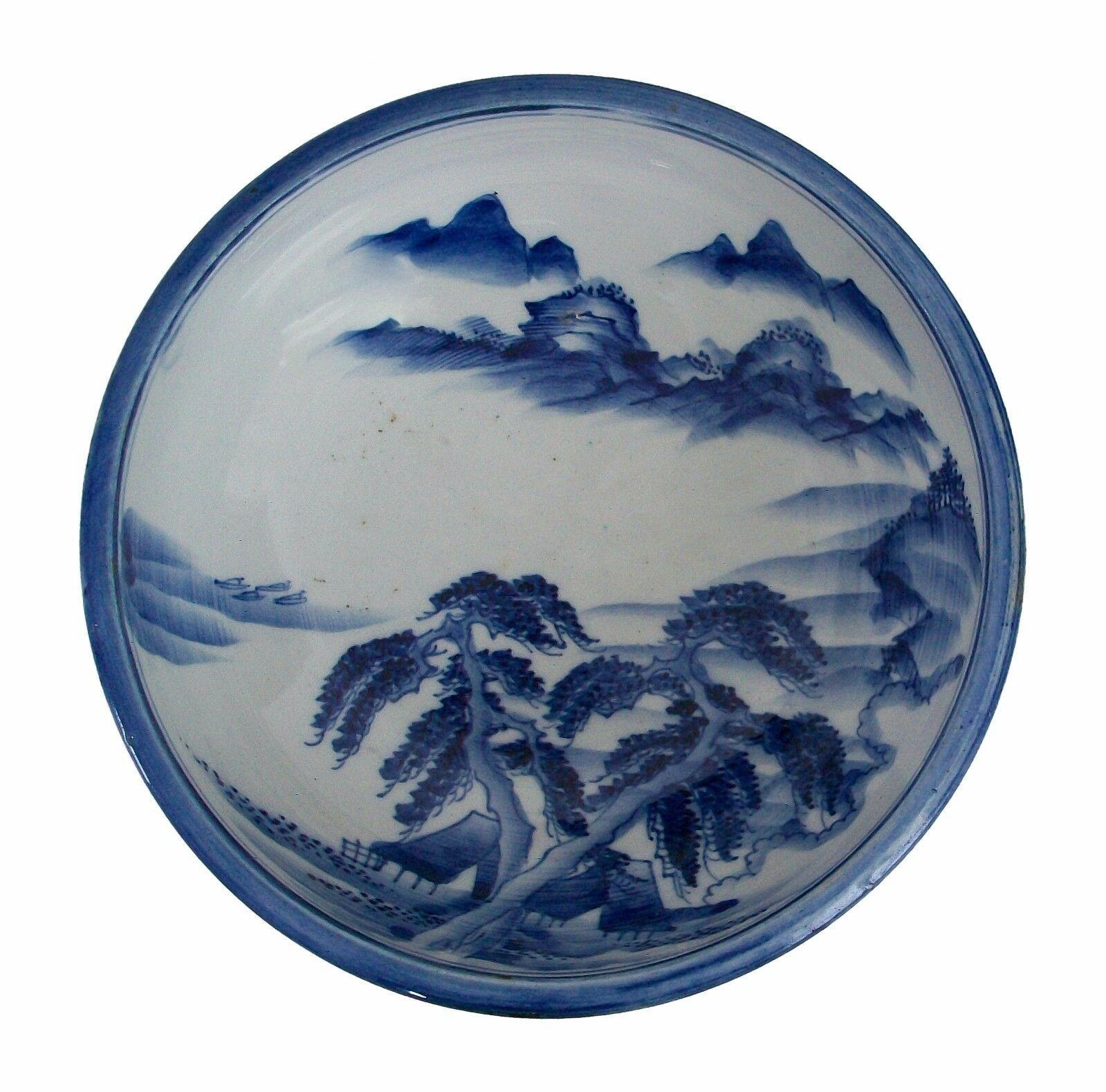 Vintage blue and white bowl - hand painted mountain views with trees - signed - Japan - mid 20th century.

Excellent vintage condition - no loss - no damage - no restoration - glaze abrasions and scratches to the inner bowl from age and