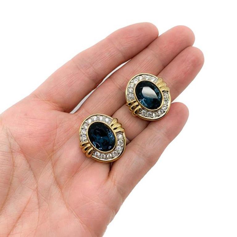 Vintage Blue & White Crystal Earrings. Featuring gold plated metal and set with blue and white crystals. In very good condition. Approx. 2.2cm. A perfect go to earring that will easily take you from day to evening wear. Should you choose to buy from