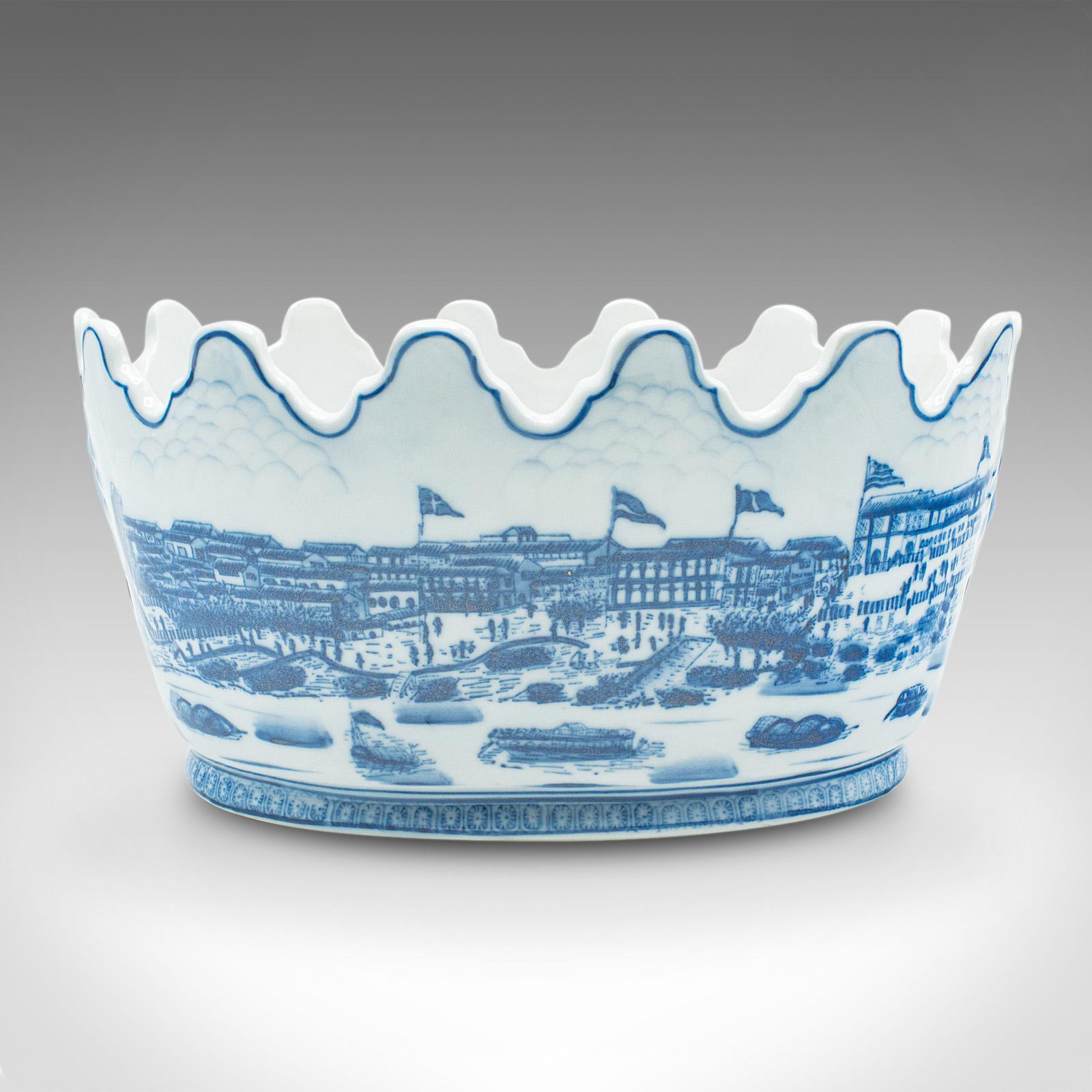 This is a vintage blue and white oval planter. A Chinese, ceramic decorative jardiniere pot, dating to the late 20th century, circa 1970.

Distinctive shape and appealing decor accentuate this planter
Displaying a desirable aged patina and in good