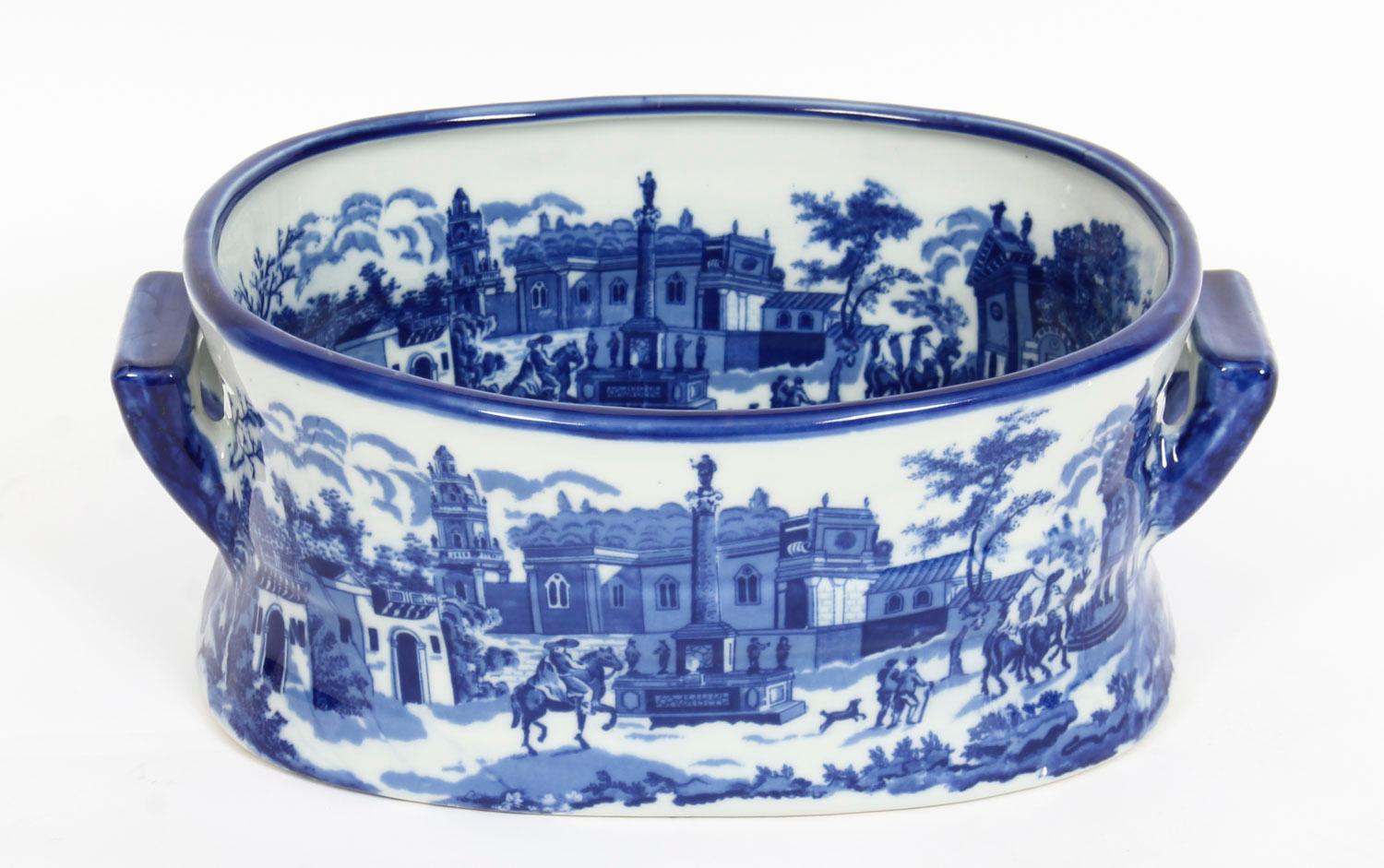 This is a delightful decorative blue and white ironstone china planter which will look fabulous with plants and flowers but is also ideal for keeping newspapers and magazines.

Bearing a printed mark on the base that reads 