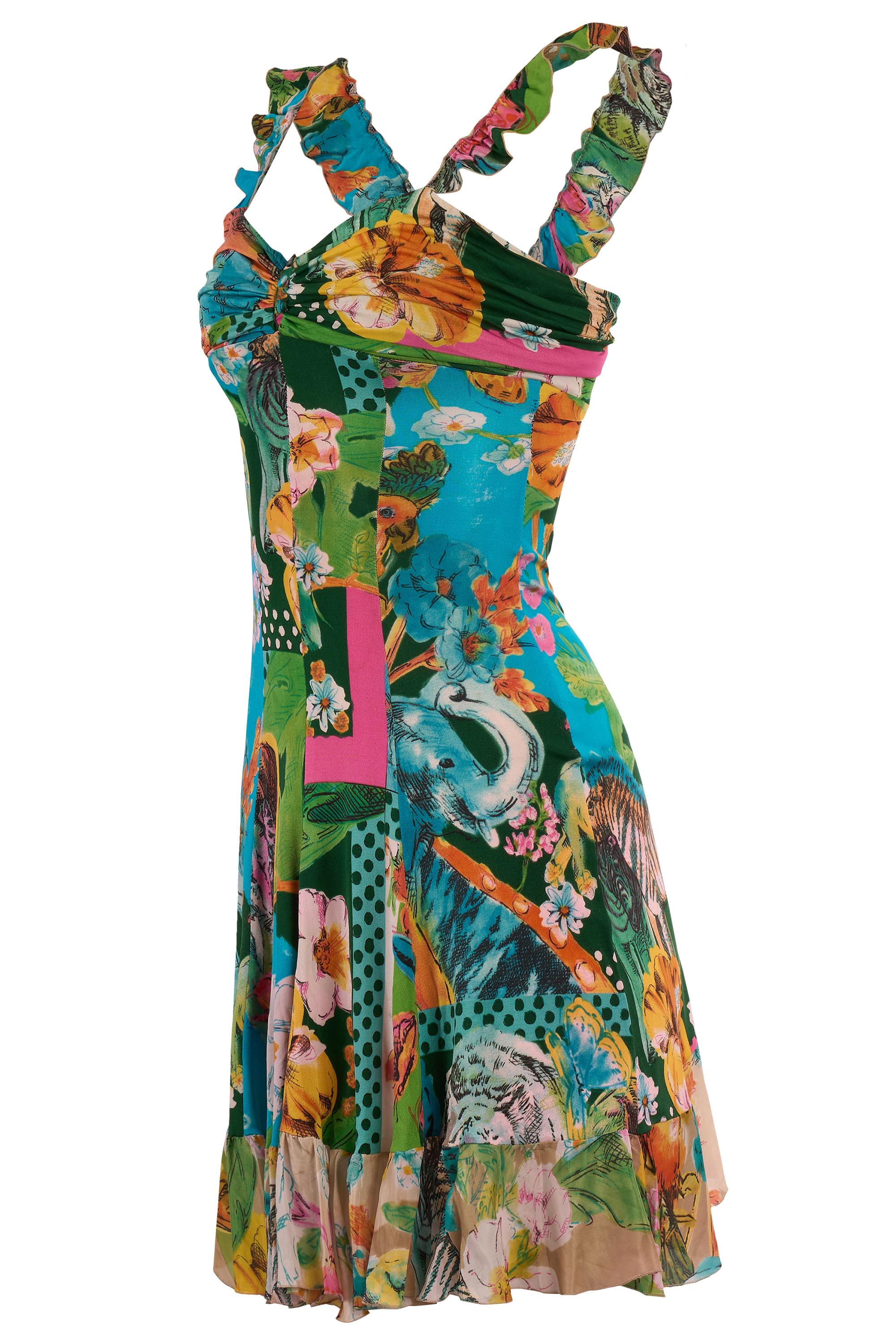 Vintage Blumarine tropical patchwork dress . Features a vivid patchwork design with exotic floral prints, wildlife imagery. The v neckline is softly ruched and finished with subtle ruffles along the shoulders. Ruffles silk hem and along the back .