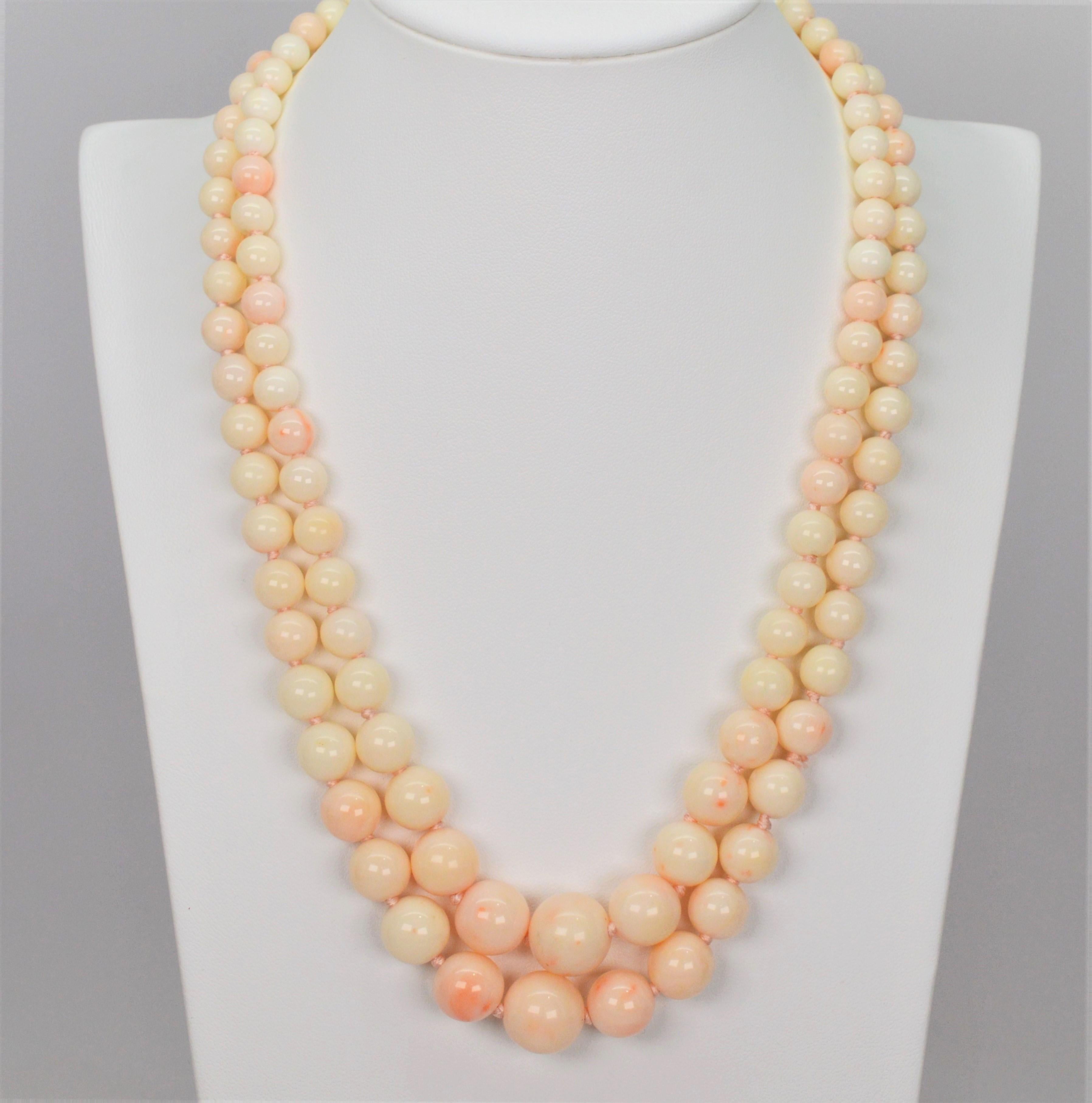 Over one hundred natural coral beads with beautiful soft blush tones drape to create this outstanding 18 inch twin strand beaded necklace.  Freshly restrung with silk and hand knotted, newly polished beads are meticulously arranged and  graduated to