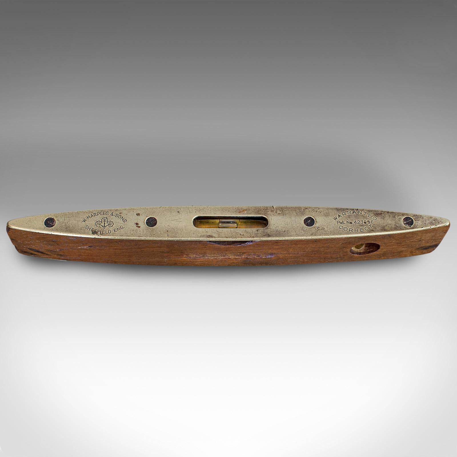 This is a vintage boat level. An English, walnut and brass torpedo spirit level by W. Marples & Sons of Sheffield, dating to the mid-20th century, circa 1950.

Appealing vintage spirit level
Displays a desirable aged patina
Walnut shows fine