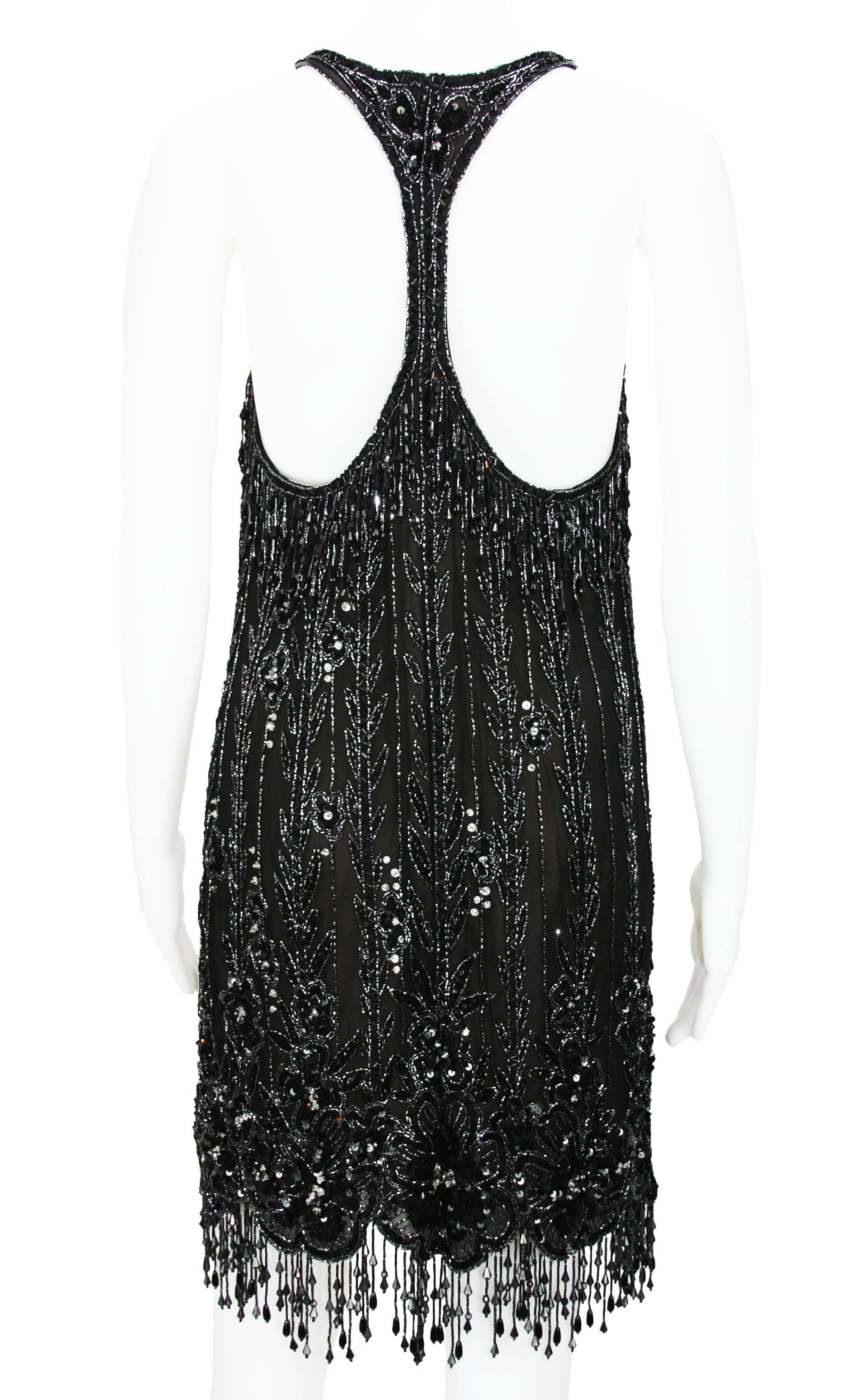 Vintage Bob Mackie Fully Beaded Mini Black Dress
Designer Size 4
Measurements: Length - 33 inches + fringe, Bust - 32/34, Waist - 28, Hips - 34. Fabric has some stretch.
Fully lined, Back zip closure.
Excellent Condition.