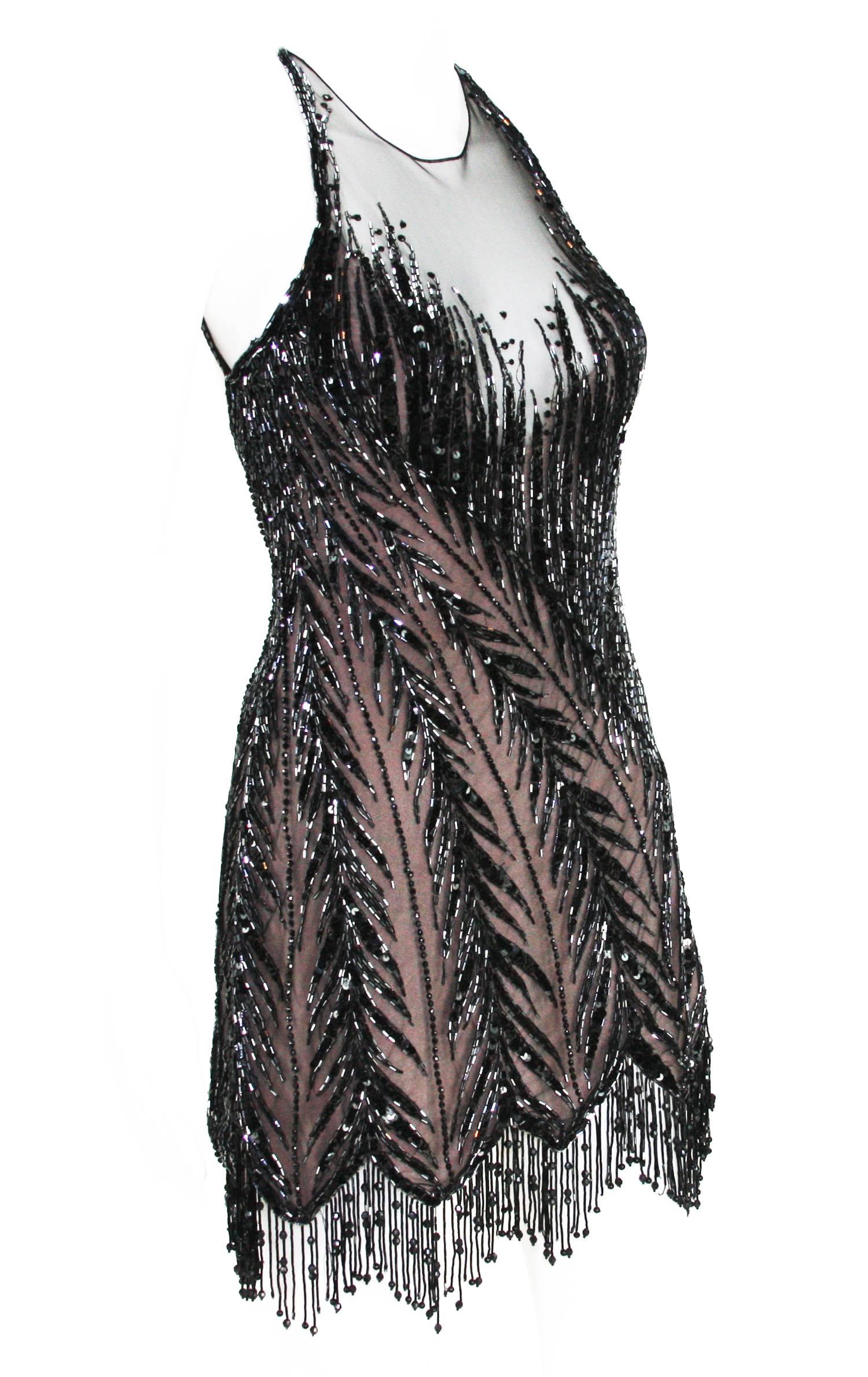 Bob Mackie 20er Jahre inspiriert Perlen Gatsby Flapper Kleid
Erhältlich in den Designergrößen 6 und 12 (bitte Maße überprüfen)
Perlenbesetztes Minikleid, vollständig gefüttert, offener Rücken, BH befestigt. Dehnbar.
Abmessungen ca: 
Größe 6: Länge -