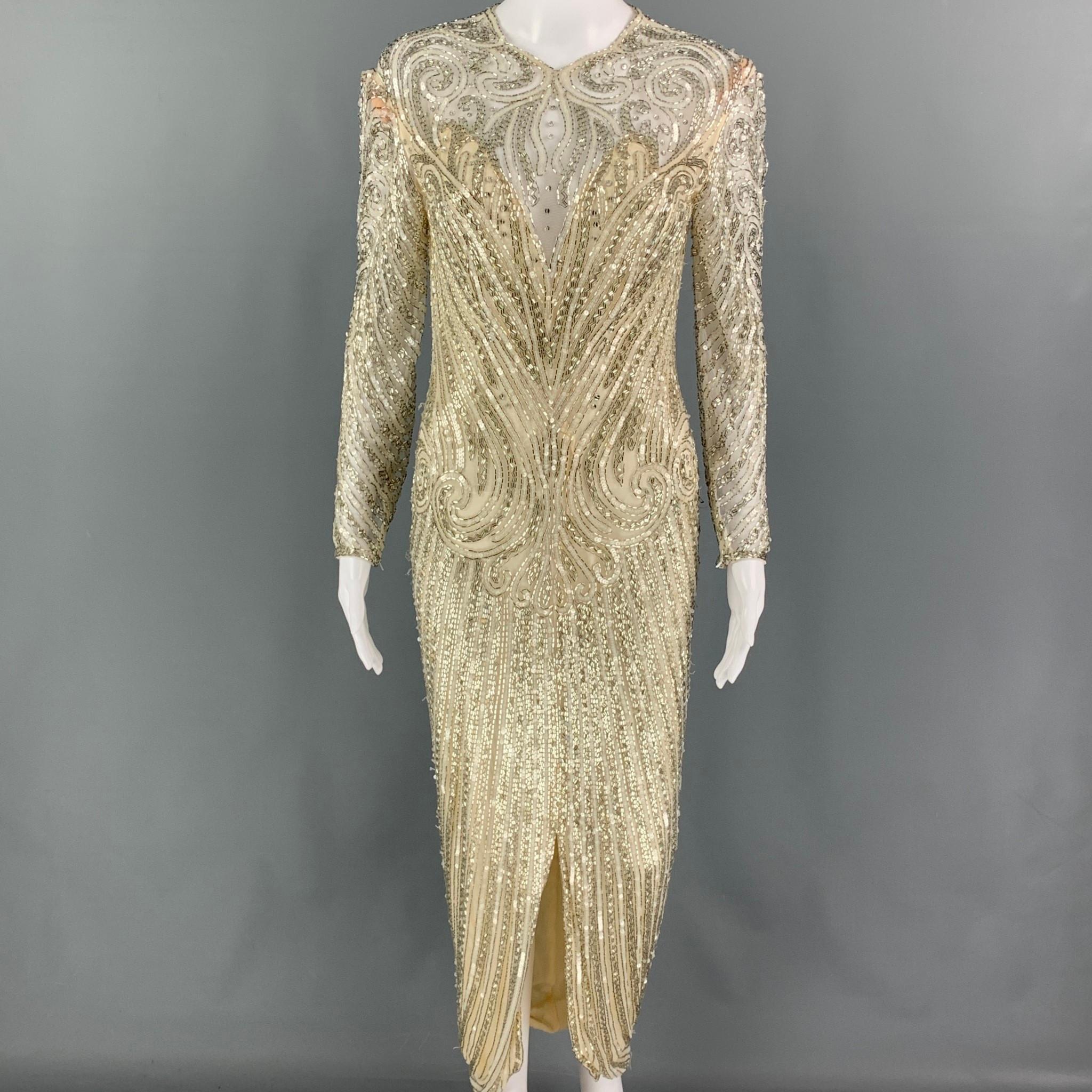 Vintage BOB MACKIE dress comes in a cream & silver silk featuring a beaded design throughout, open back, fitted, hook & loop detail, and back zipper closure. 

Very Good Pre-Owned Condition. Light wear at closure. As-is.
Marked: