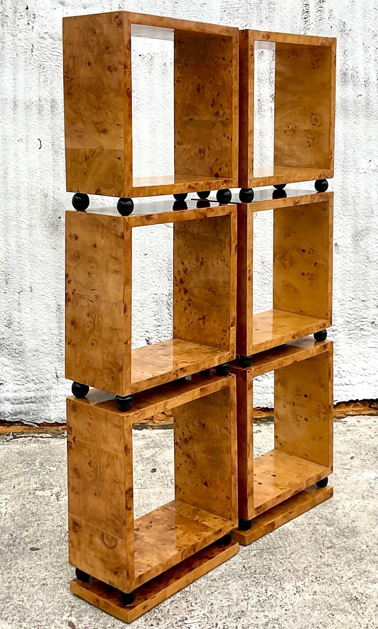 A striking pair of vintage Boho etagere. Beautiful stacked Burl wood boxes with black lacquered spheres in between. Acquired from a Palm Beach estate.